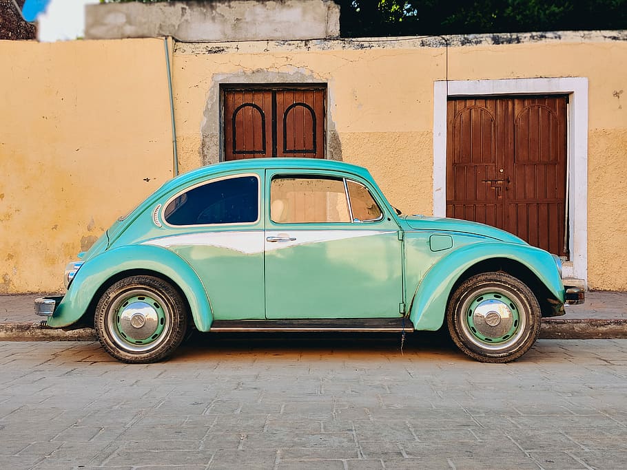 HD Wallpaper Teal Volkswagen Beetle Parked Near Brown House Photo Of