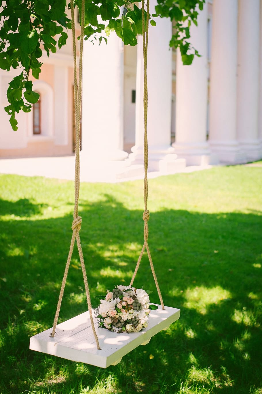 Swinging in flower garden