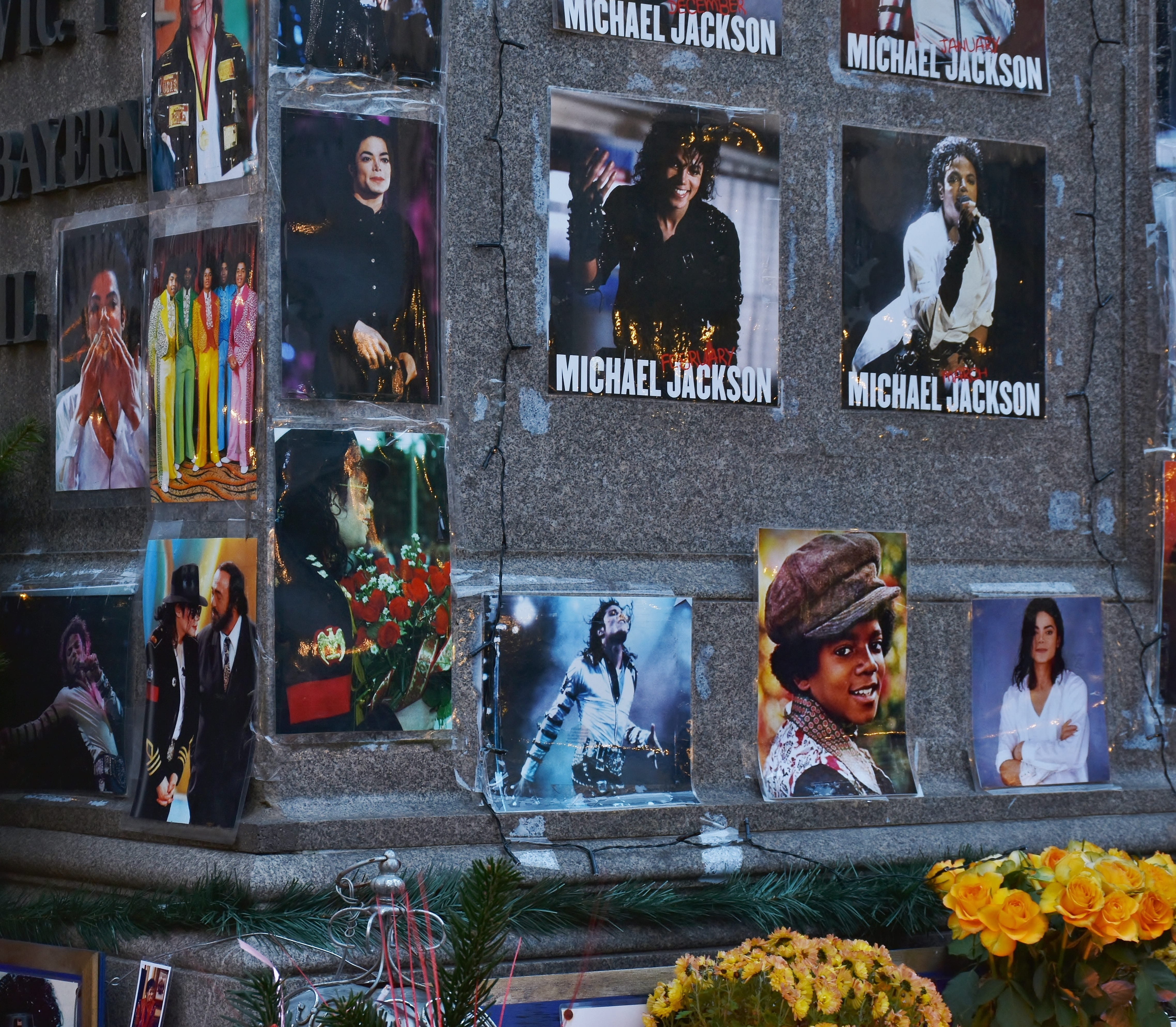 Michael Jackson memorabilia photos on gray wall, singer, star