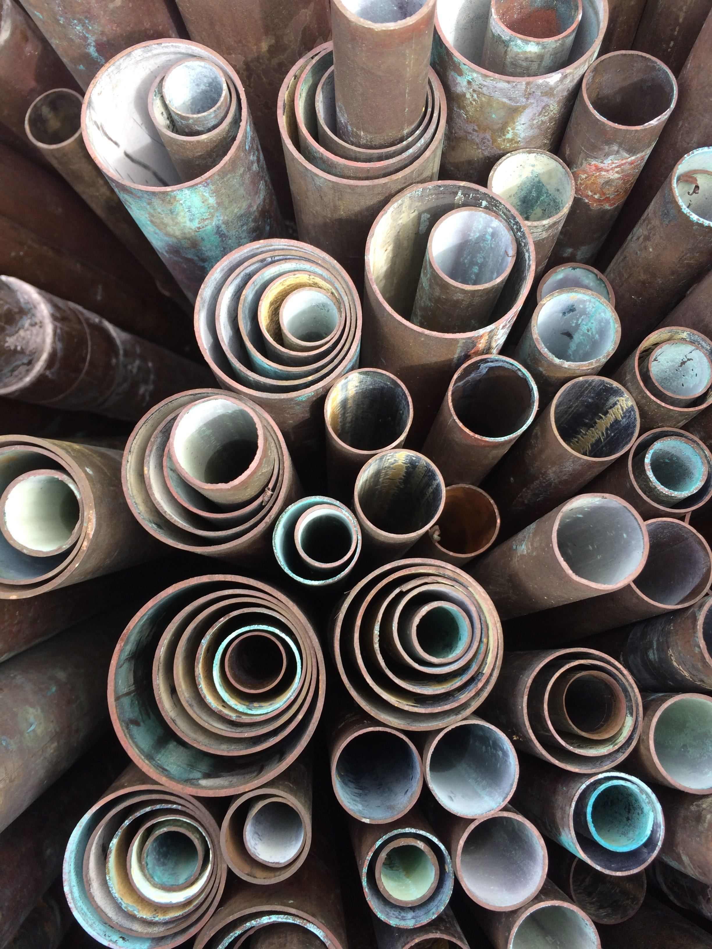 copper pipes, pipe ends, concentric circles, large group of objects