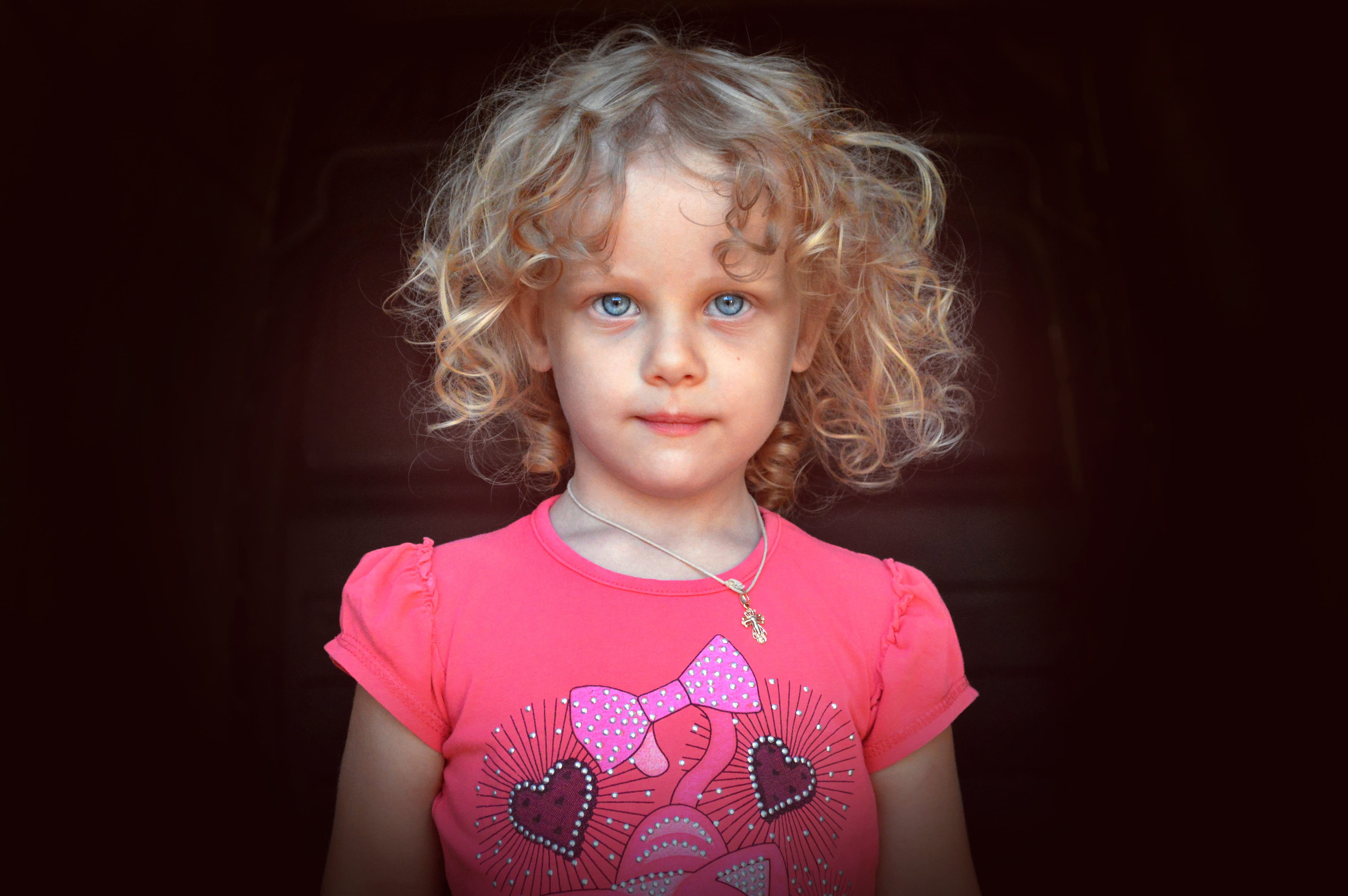 girl in pink crew-neck top, child, portrait, blonde, curly, christian