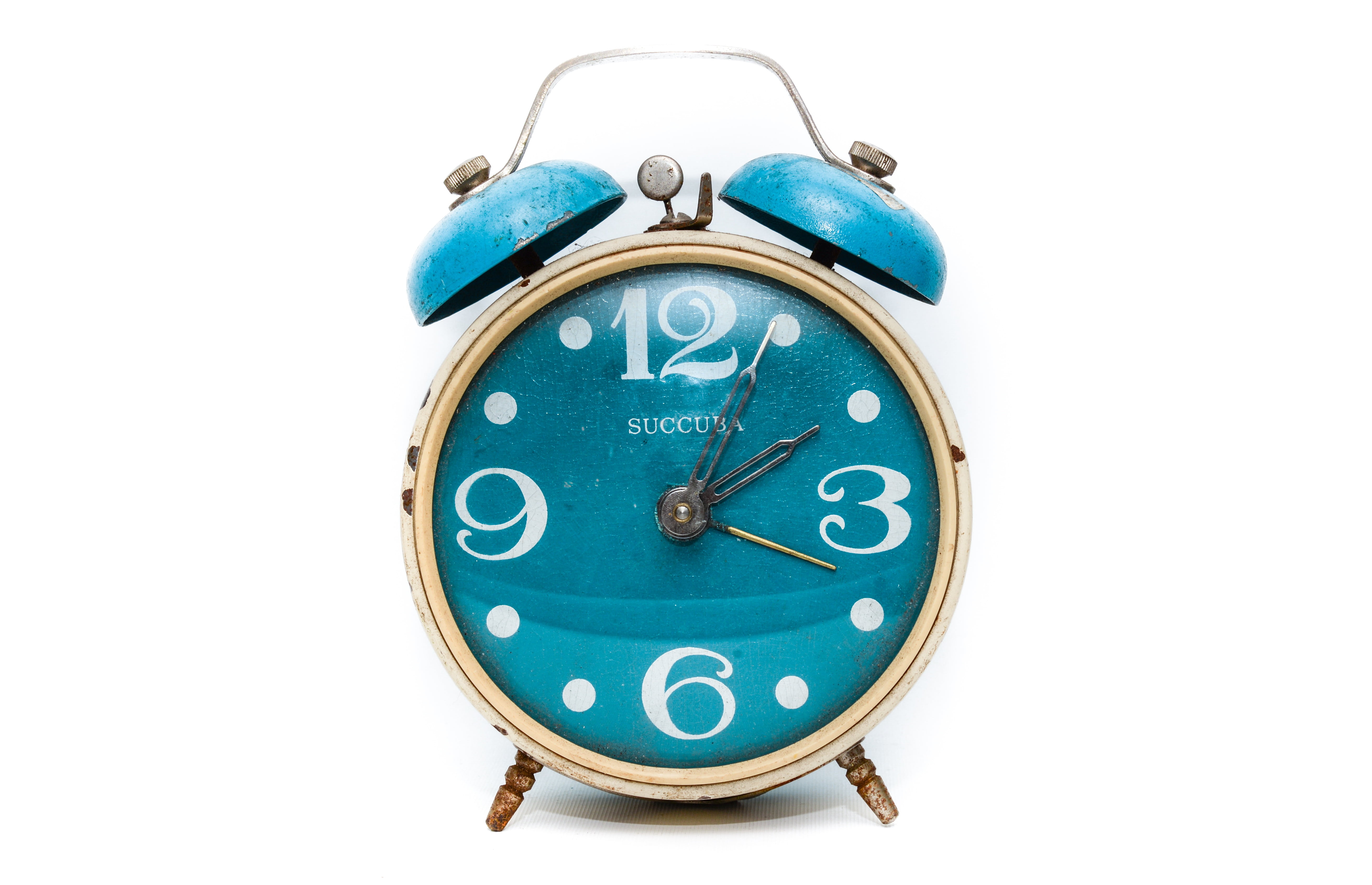 round brass-colored and blue alarm clock, time, hour, minute
