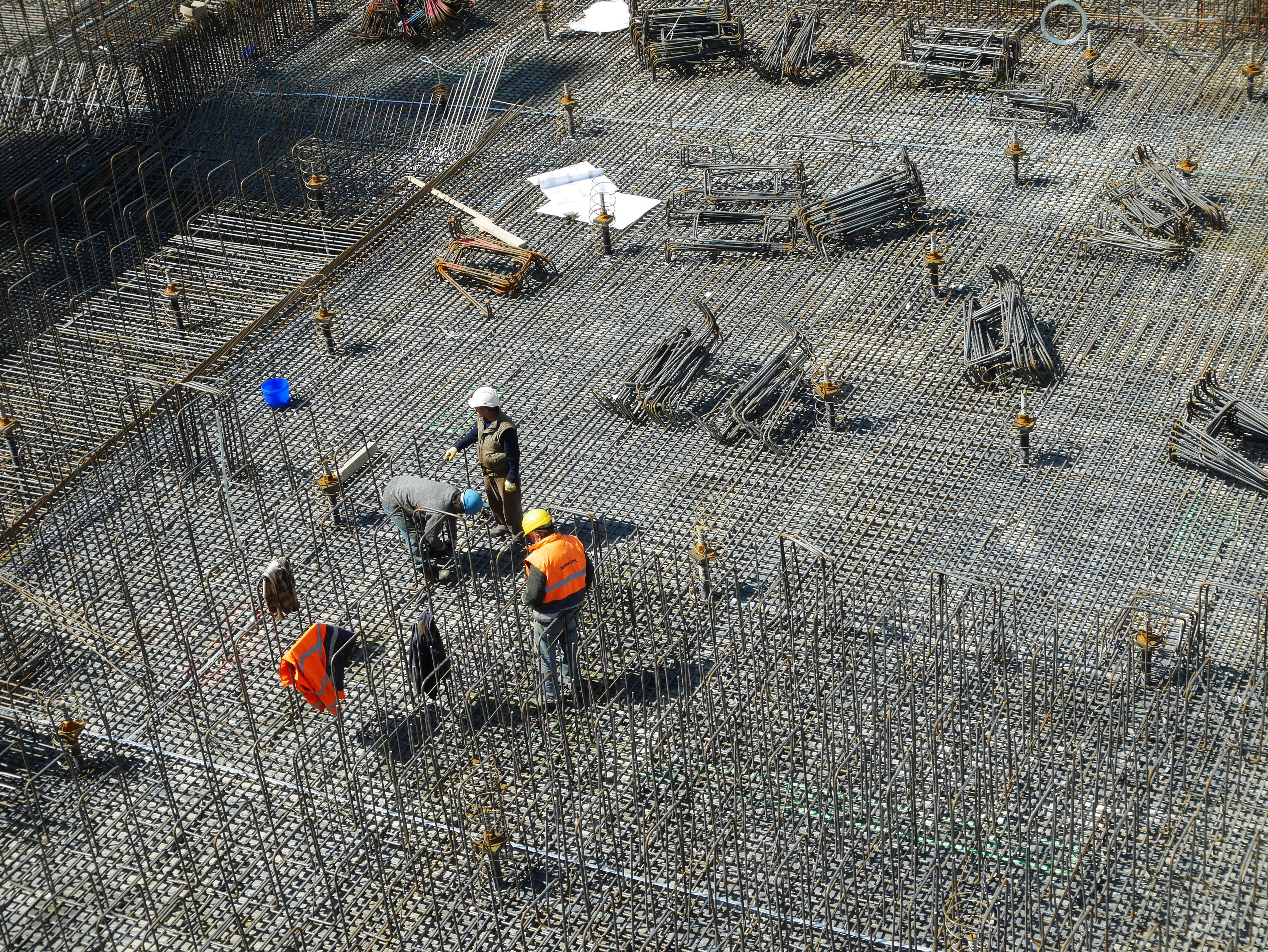 three man working together, construction site, construction workers