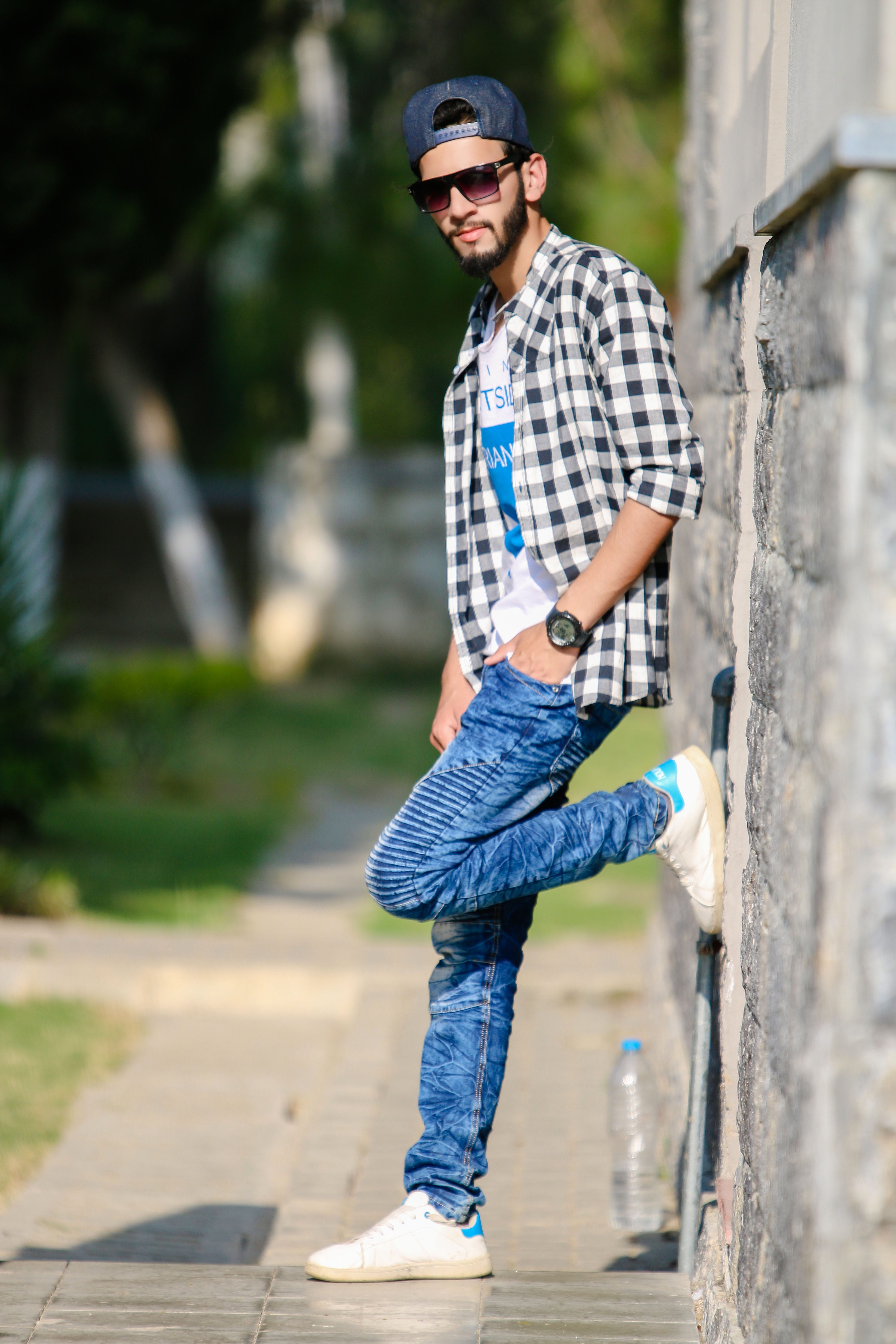 man leaning his left foot against the wall, fashion, style, boys fashion