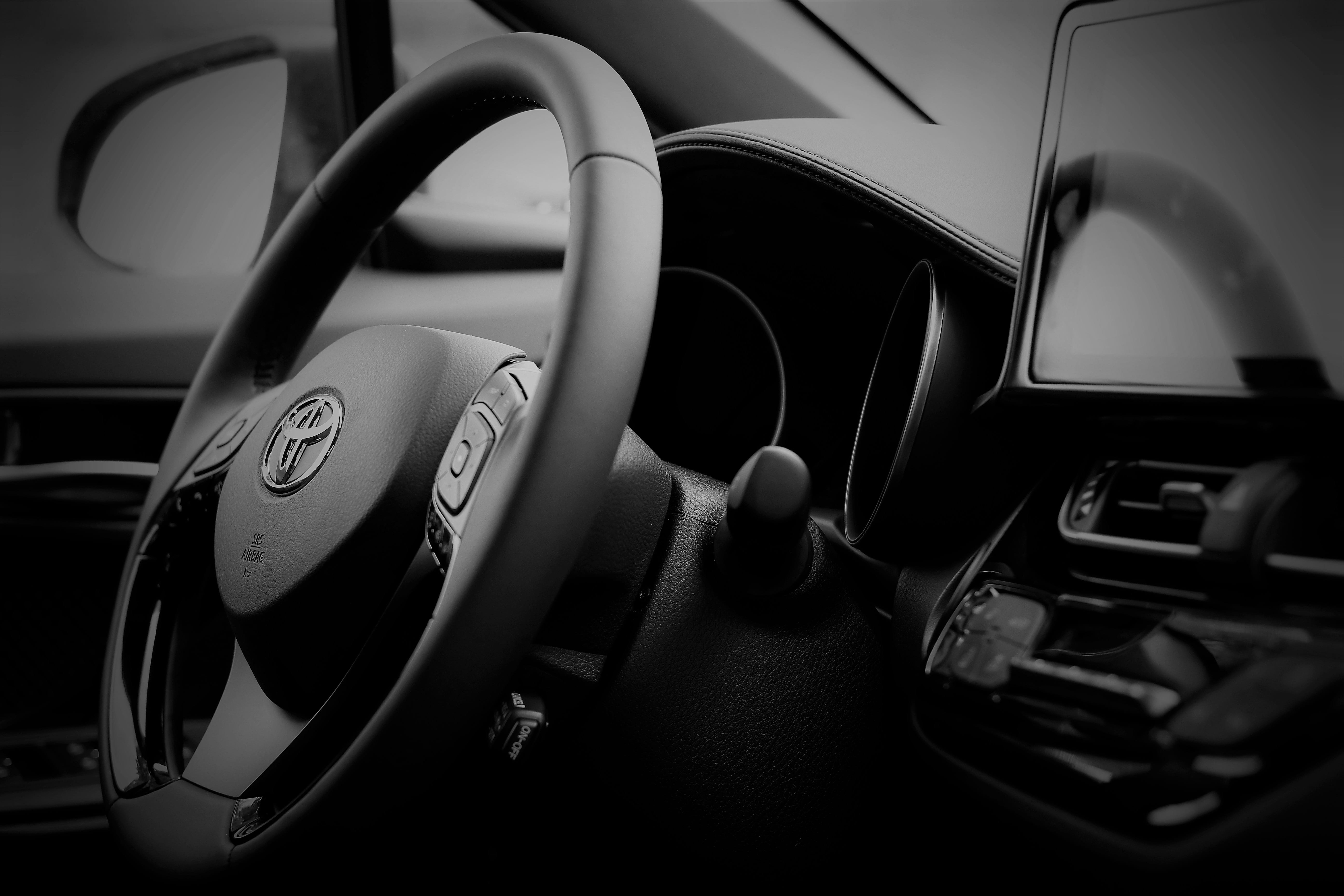 grayscale photography of Toyota vehicle steering wheel, toyota c-hr