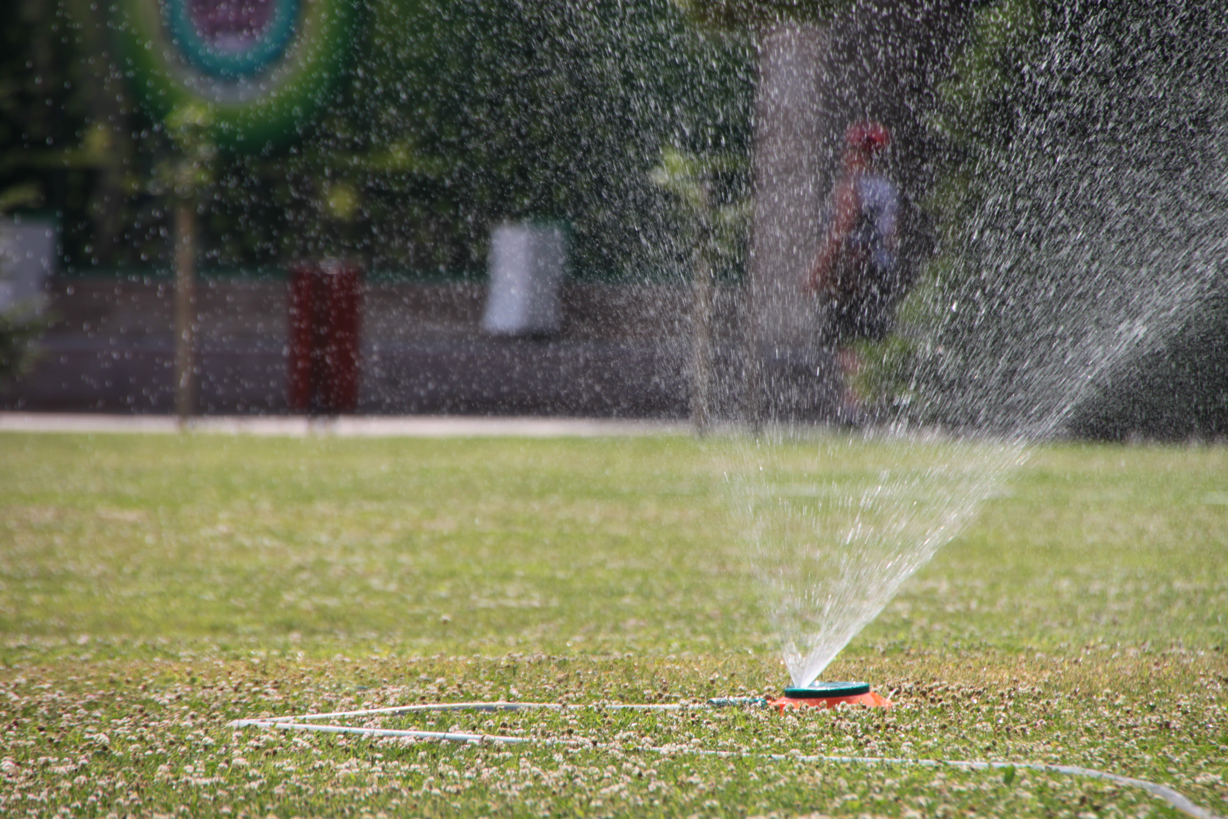 water sprinkler on field at daytime, city, garden, grass, green