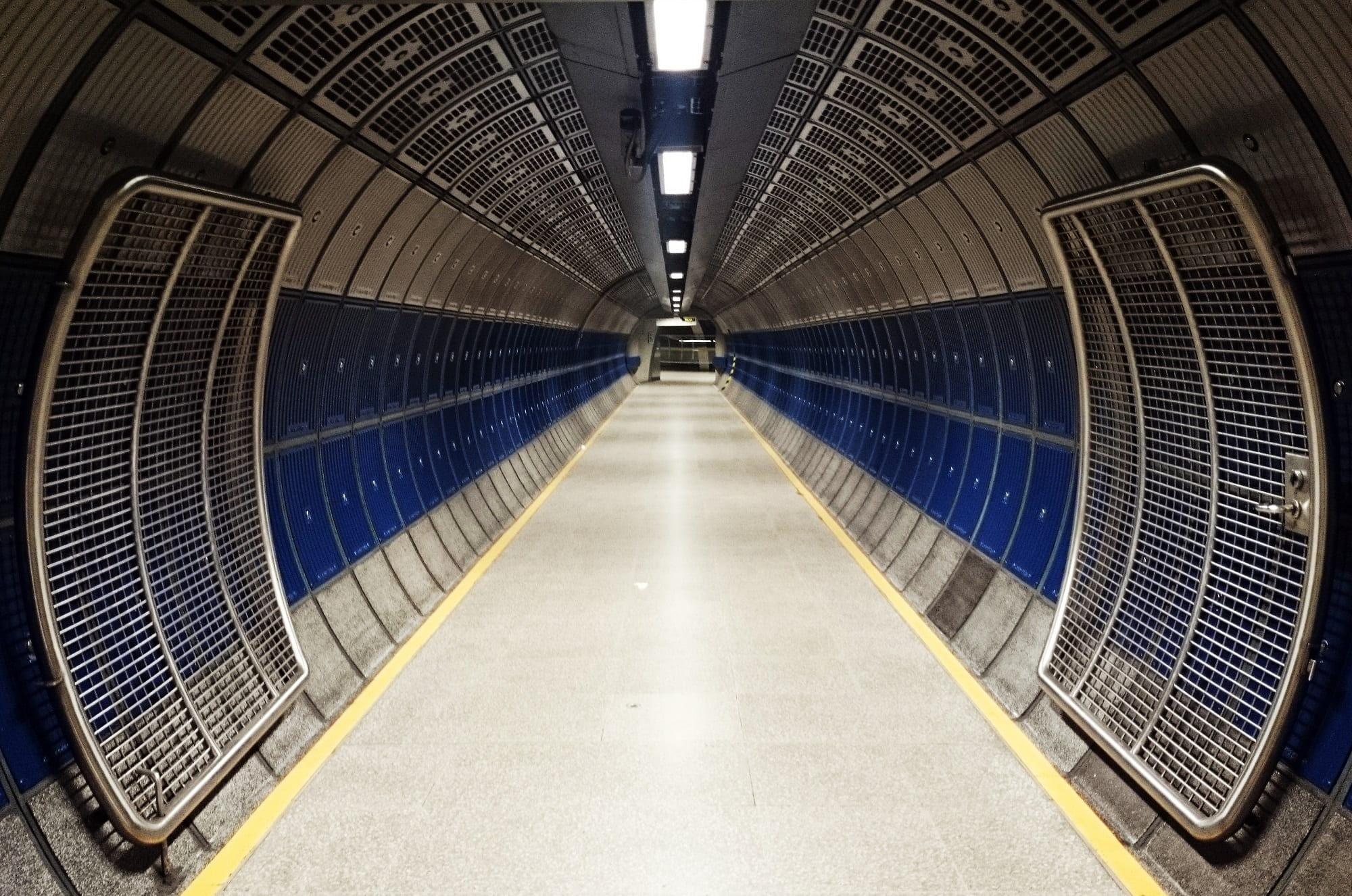 photo of blue and grey tunnel during daytime, corridor, underground
