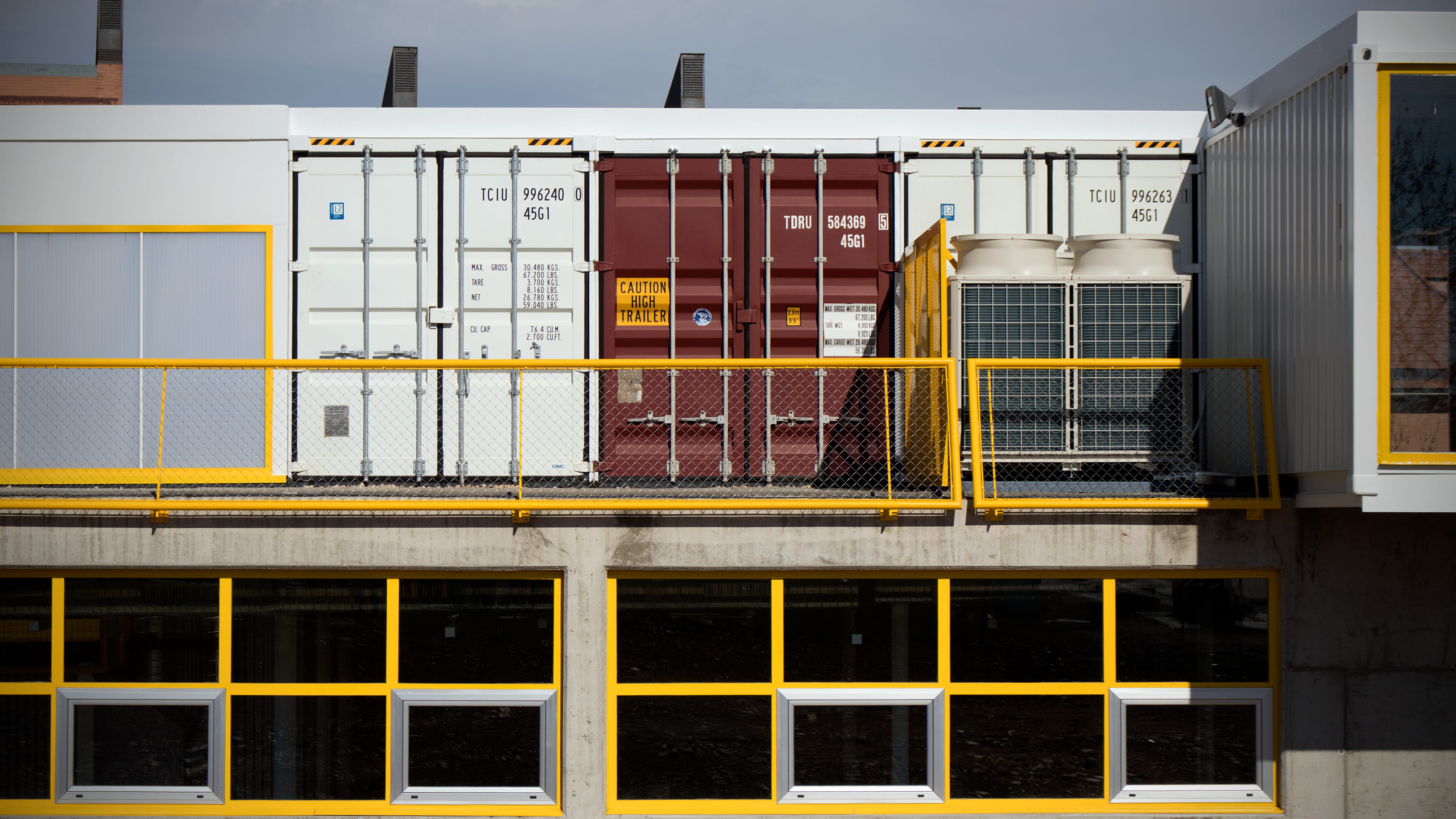 assorted shipping trailers, assorted-color intermodal containers on ground