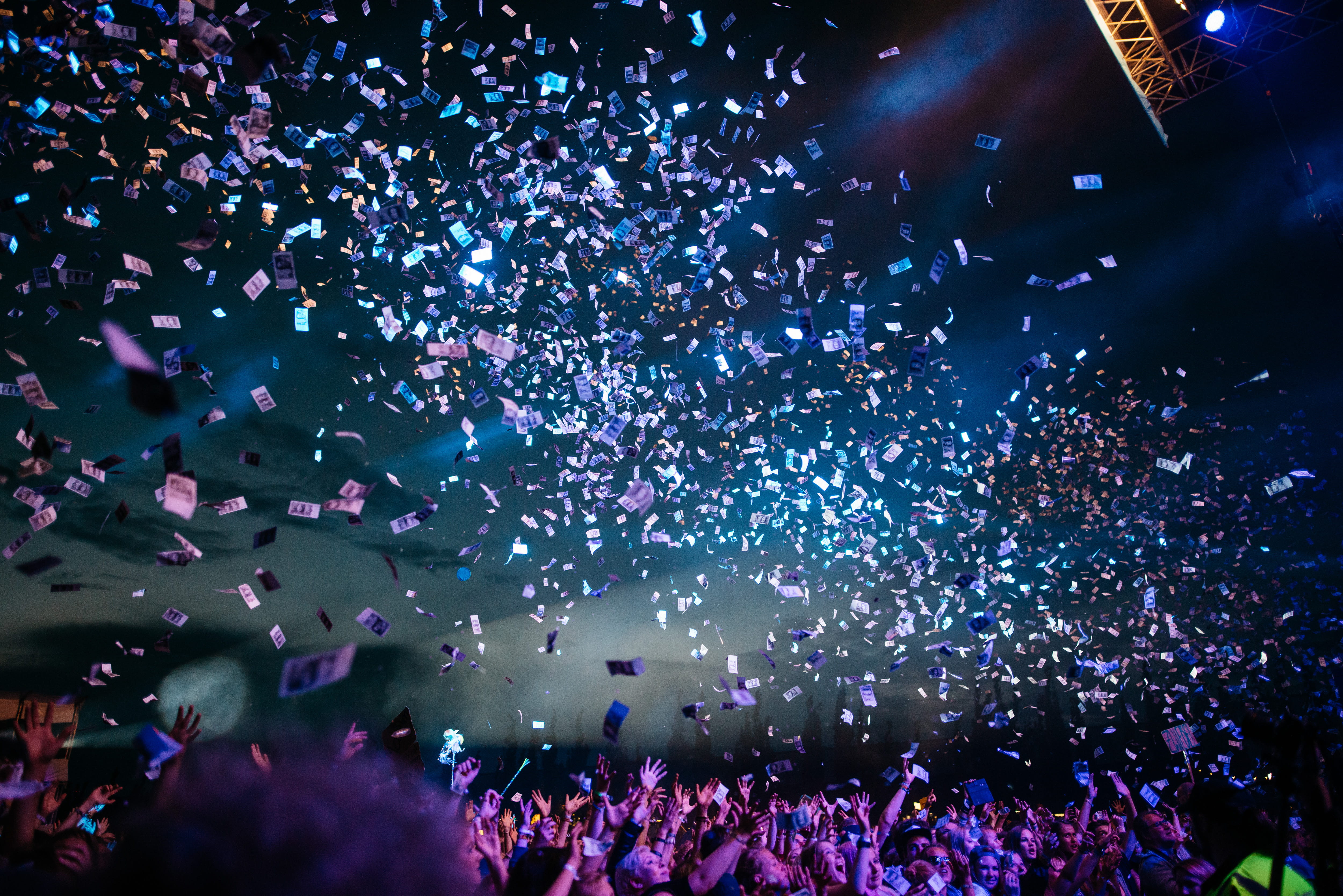 people partying with confetti, photo of group of people, bomb