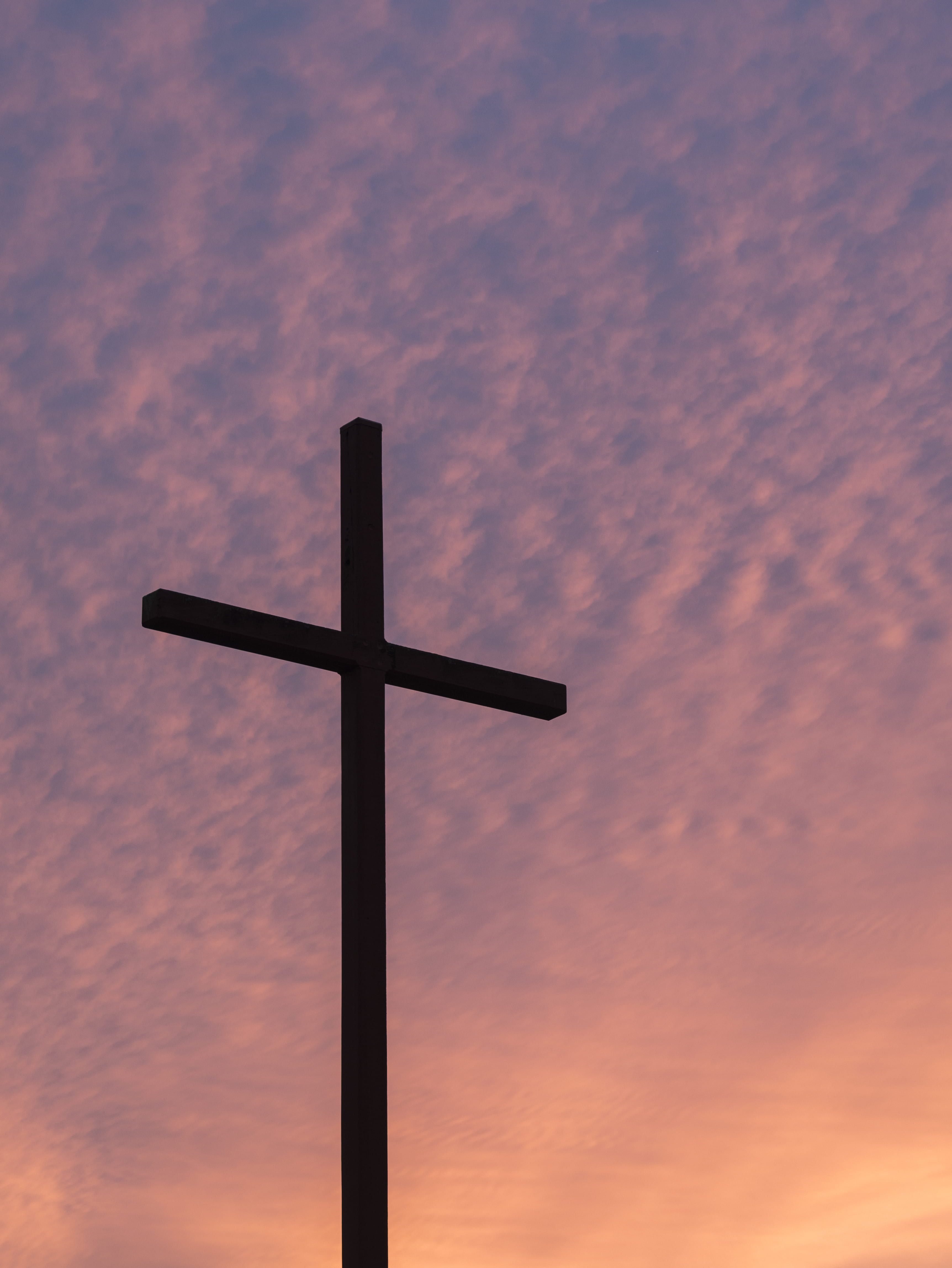 silhouette of large cross during daytime, silhouette of cross under against calm sky