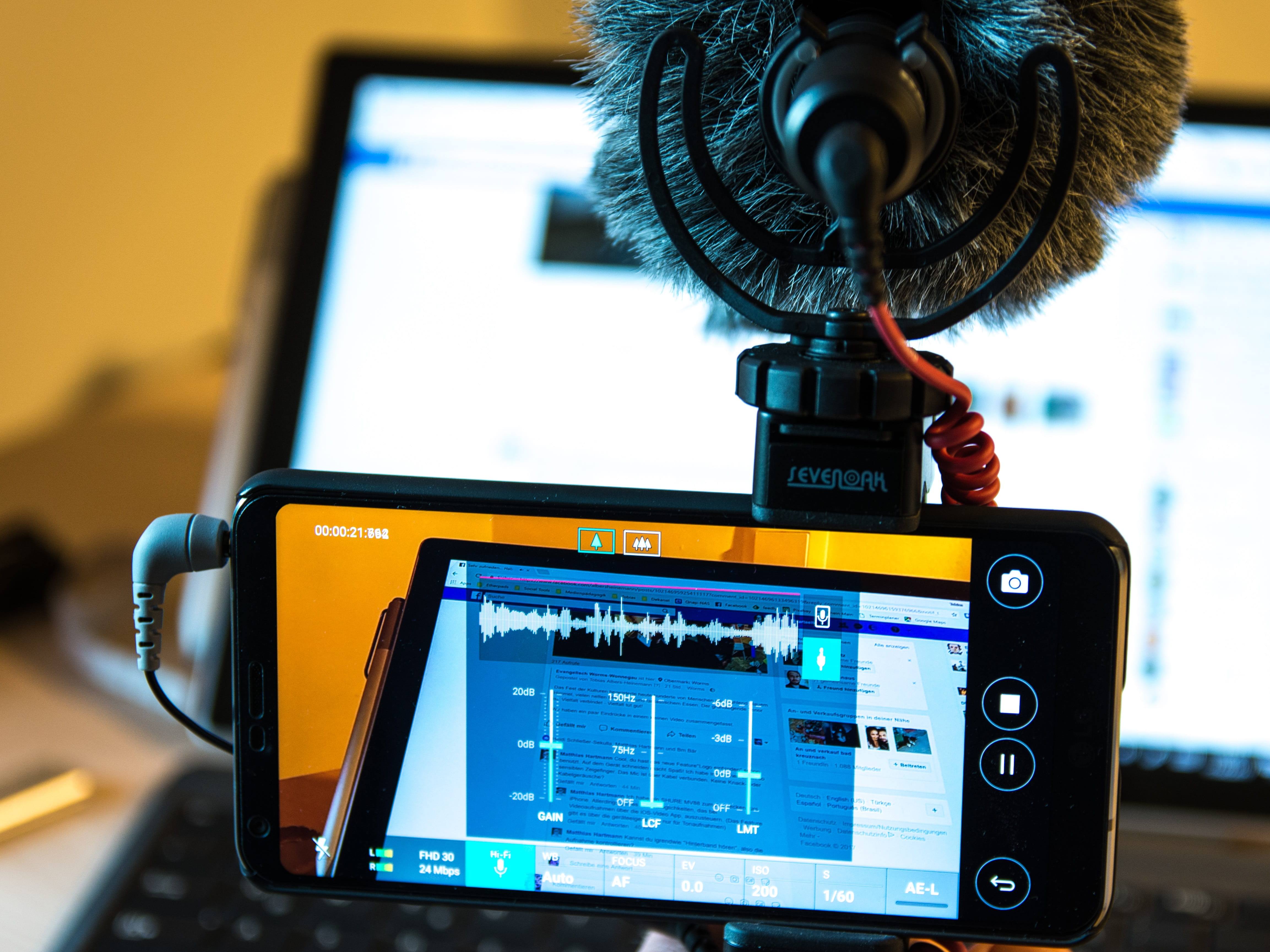 black Android smartphone displaying music editing, mobile, reporting