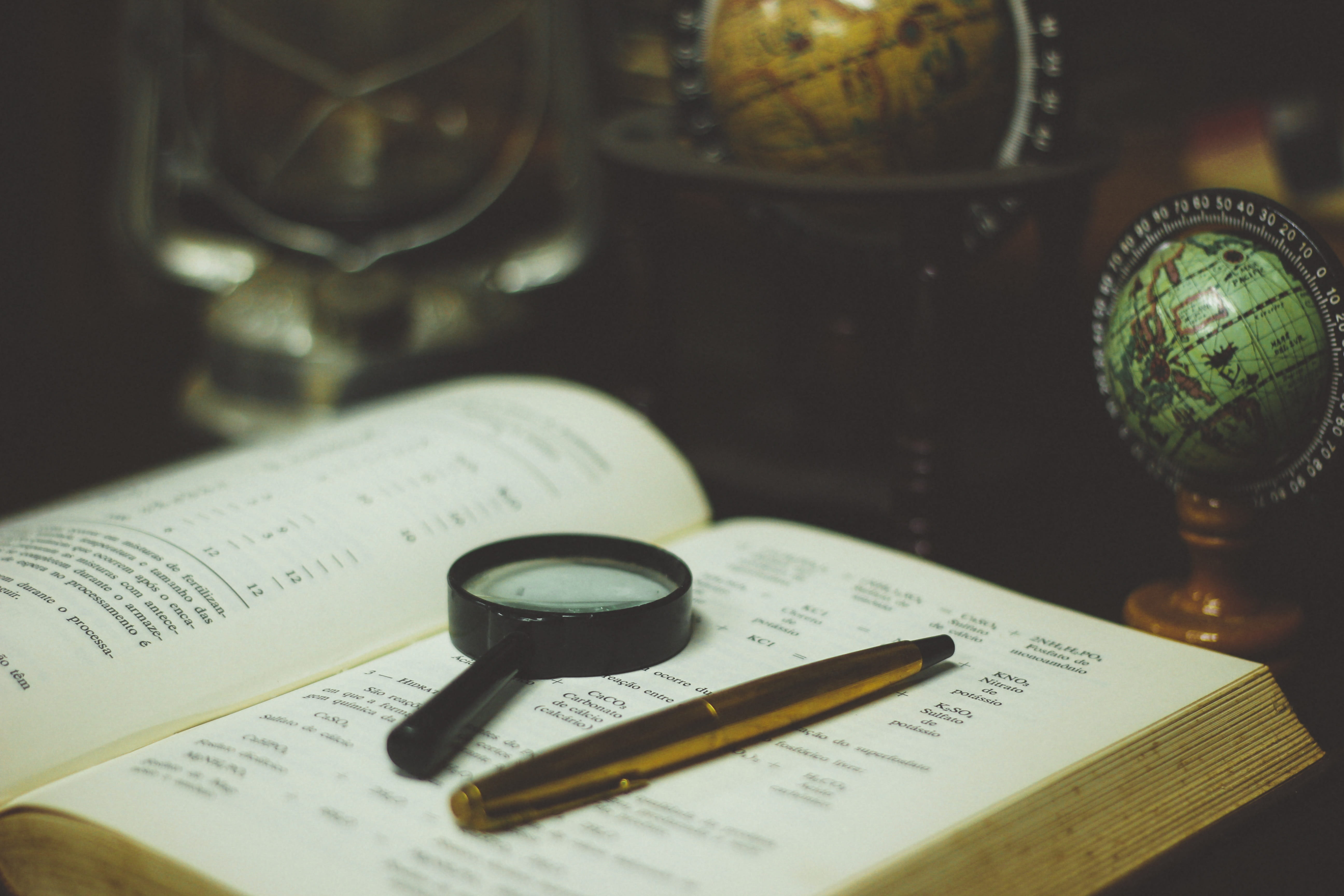 black magnifying glass on white book, reading, learning, study