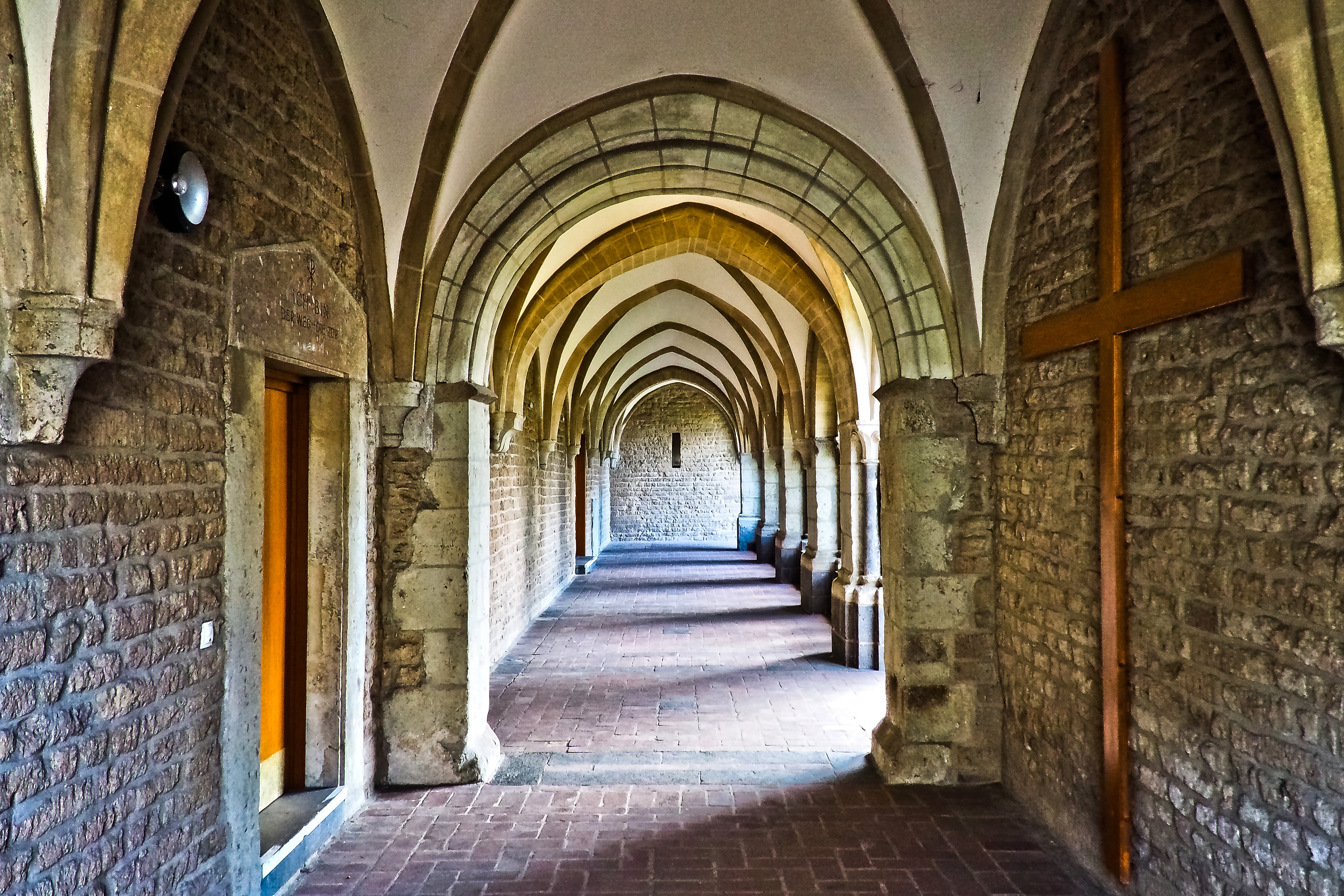 interior photo of brown stone building, church, cloister, architecture