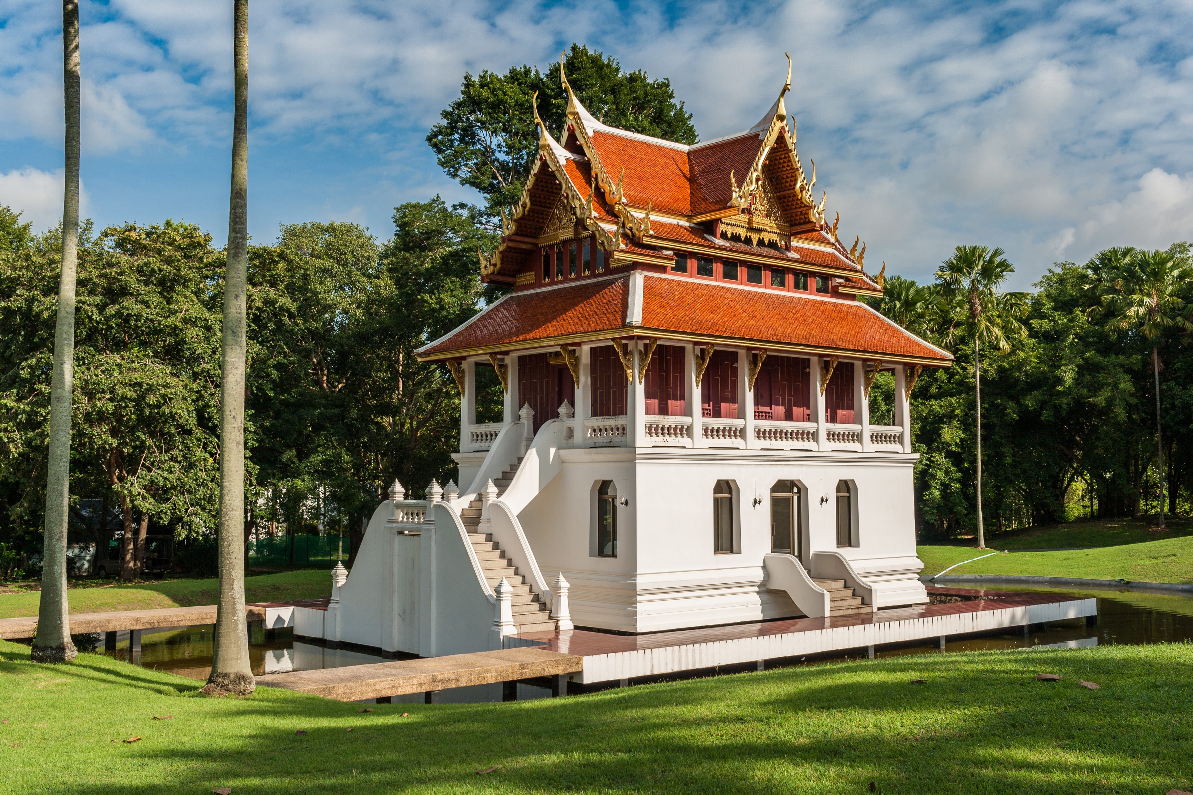 brown and white house near trees, buddhist temple complex thailand