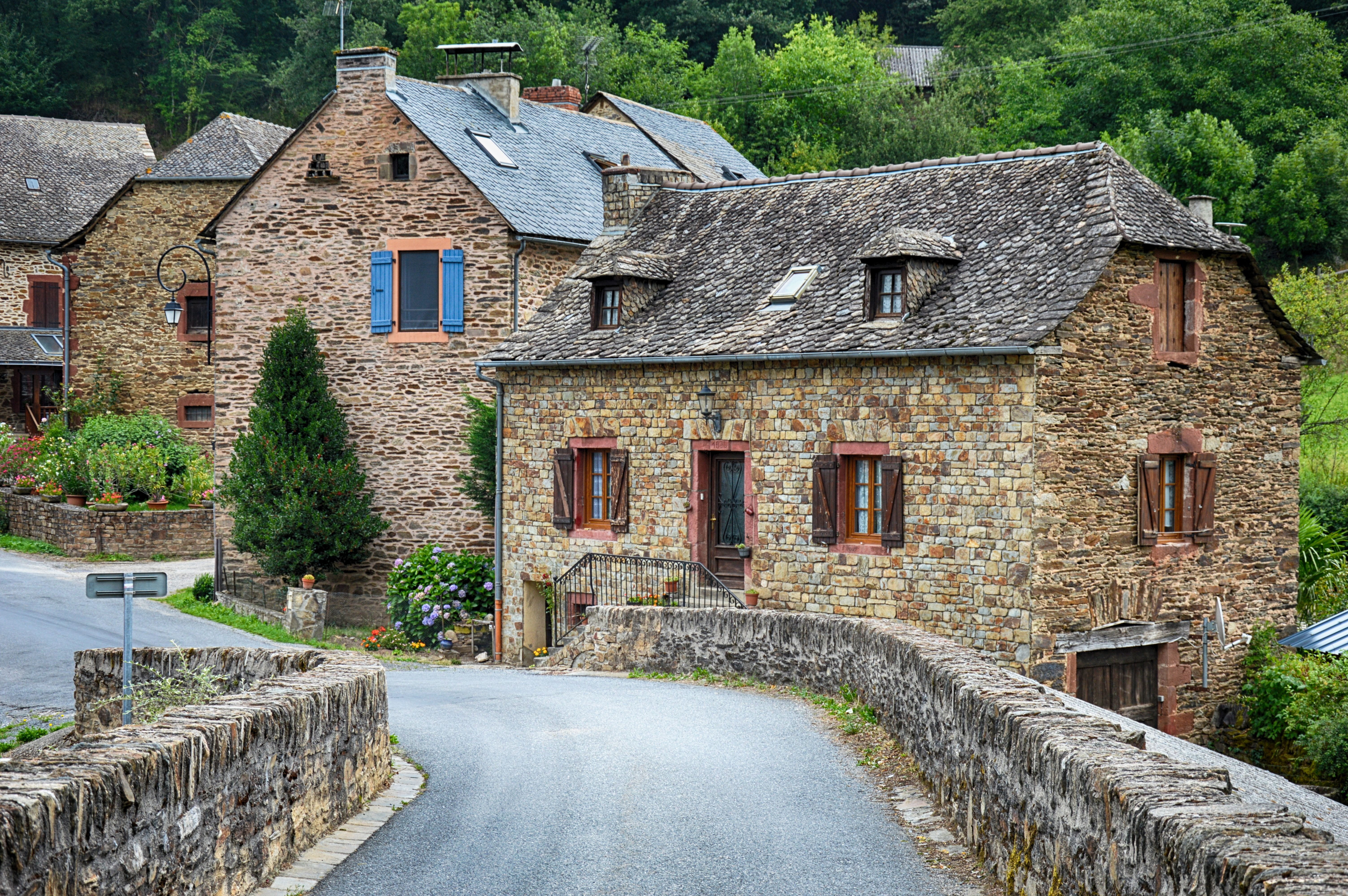 photo of bridge near house and trees, old village, old house