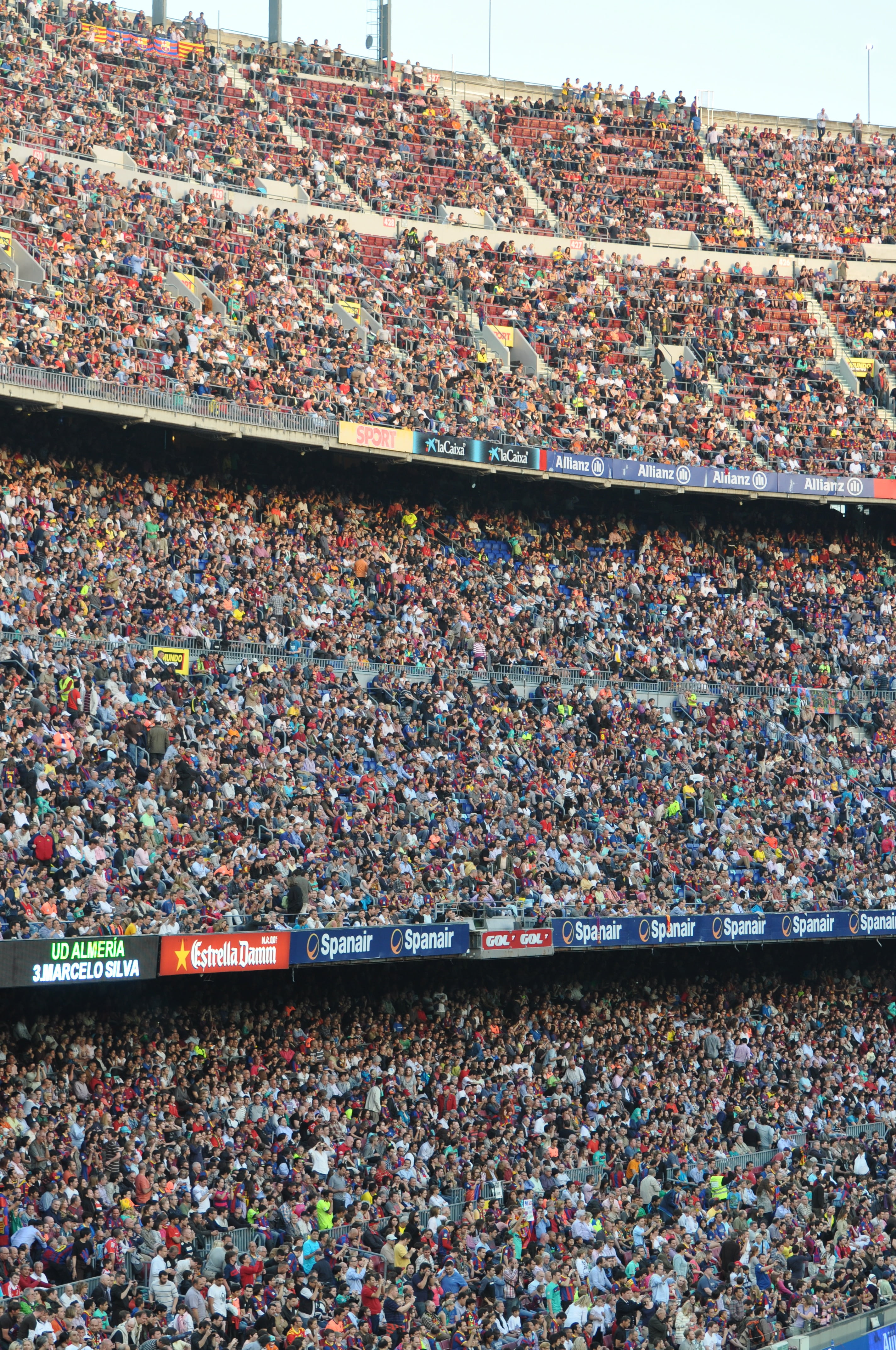 group of people siting side on arena, camp nou, fair, audience