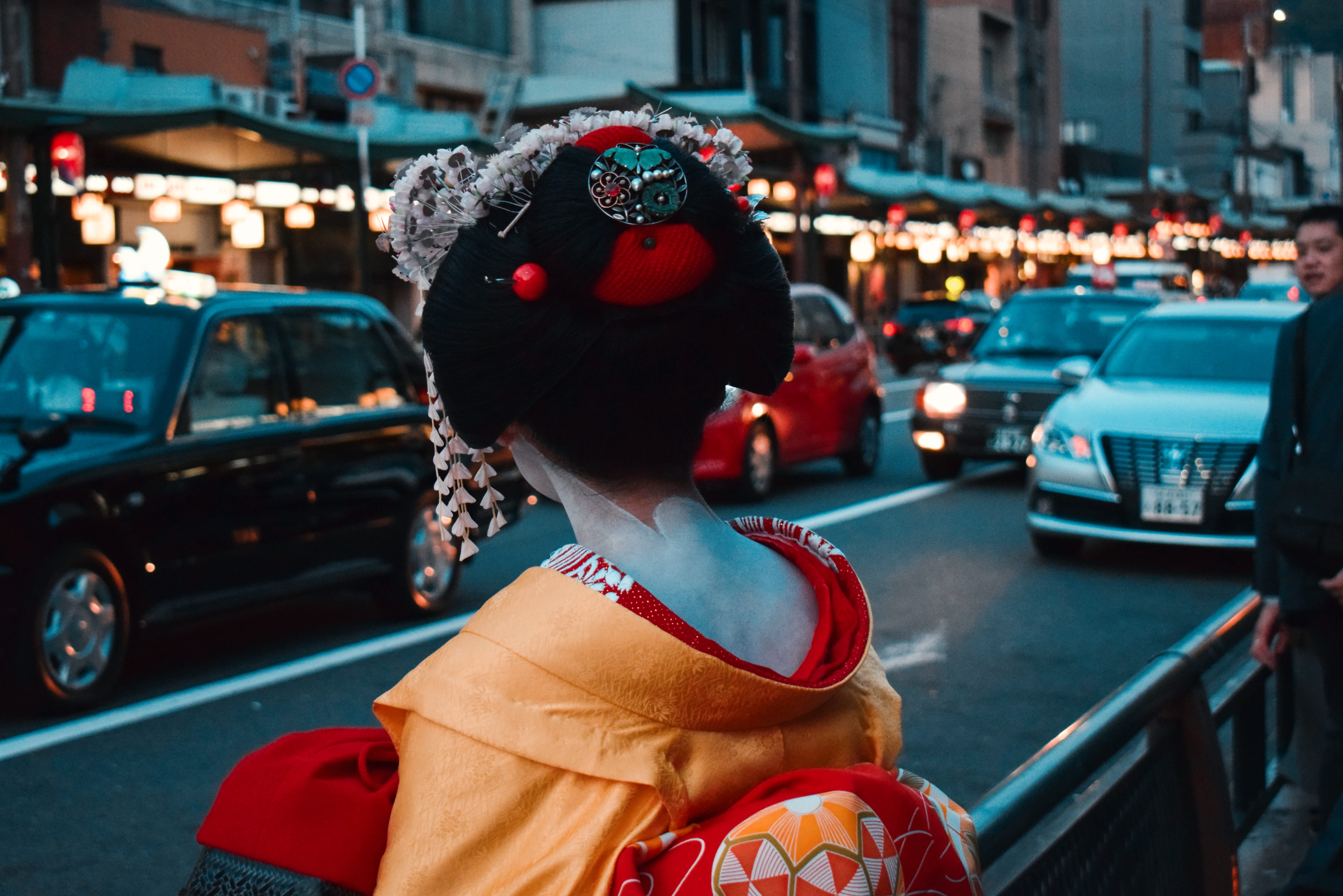 selective focus photography of geisha standing on street while facing on car, Geisha fronting highway