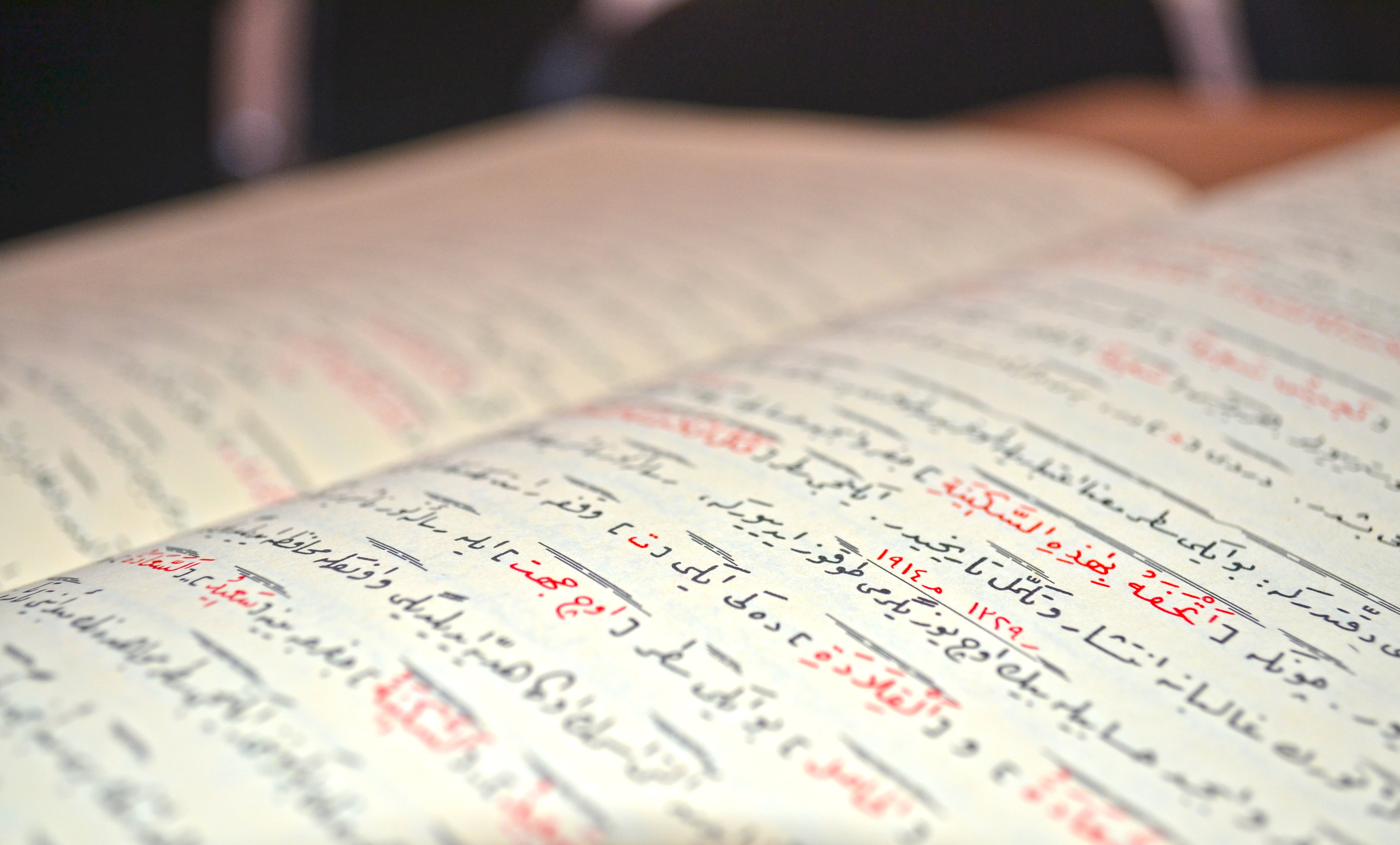 opened book with handwriting, quran, arabic, islam, text, selective focus