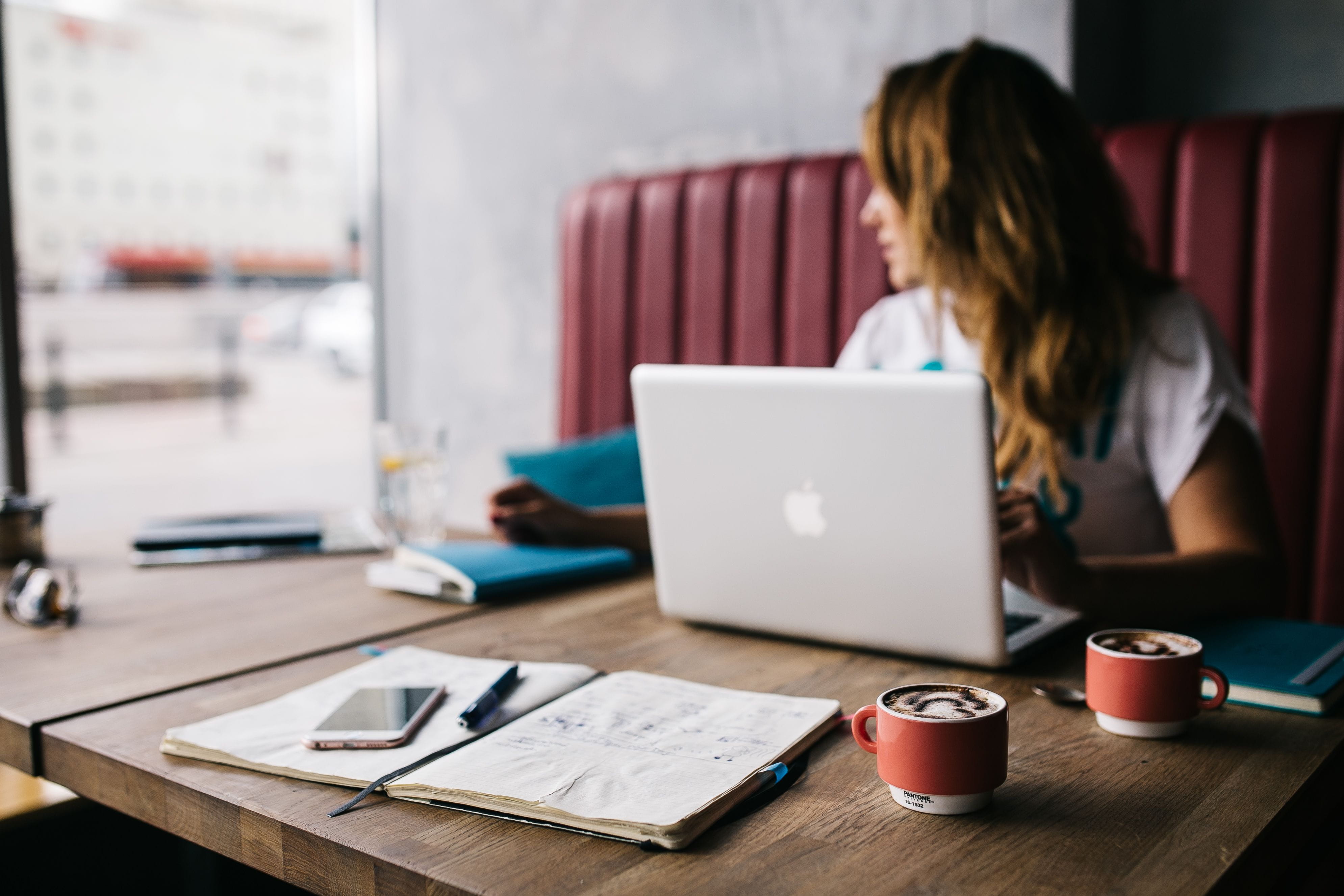 Young woman working in a cafe, caucasian, female, office, workspace