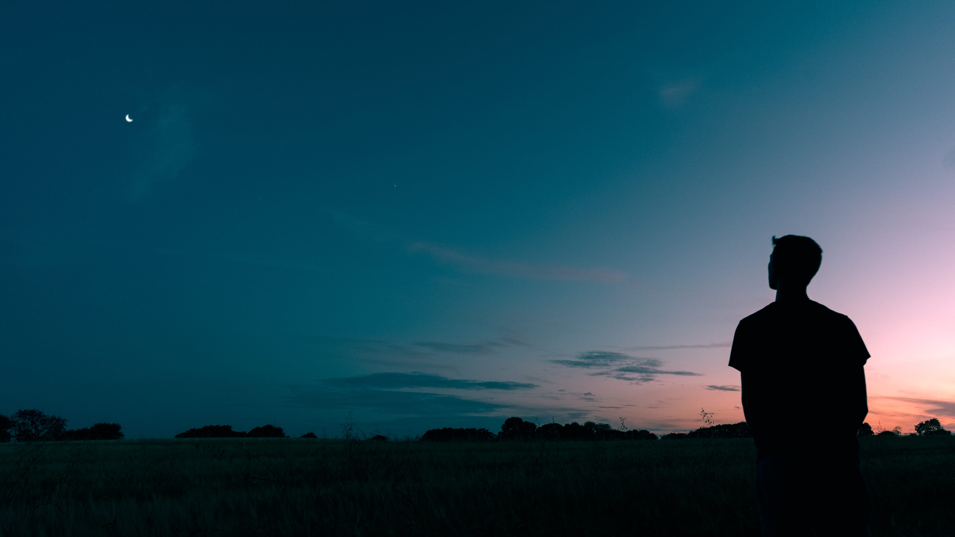 silhouette of man looking star during sunset, silhouette photography of man standing and starring moon
