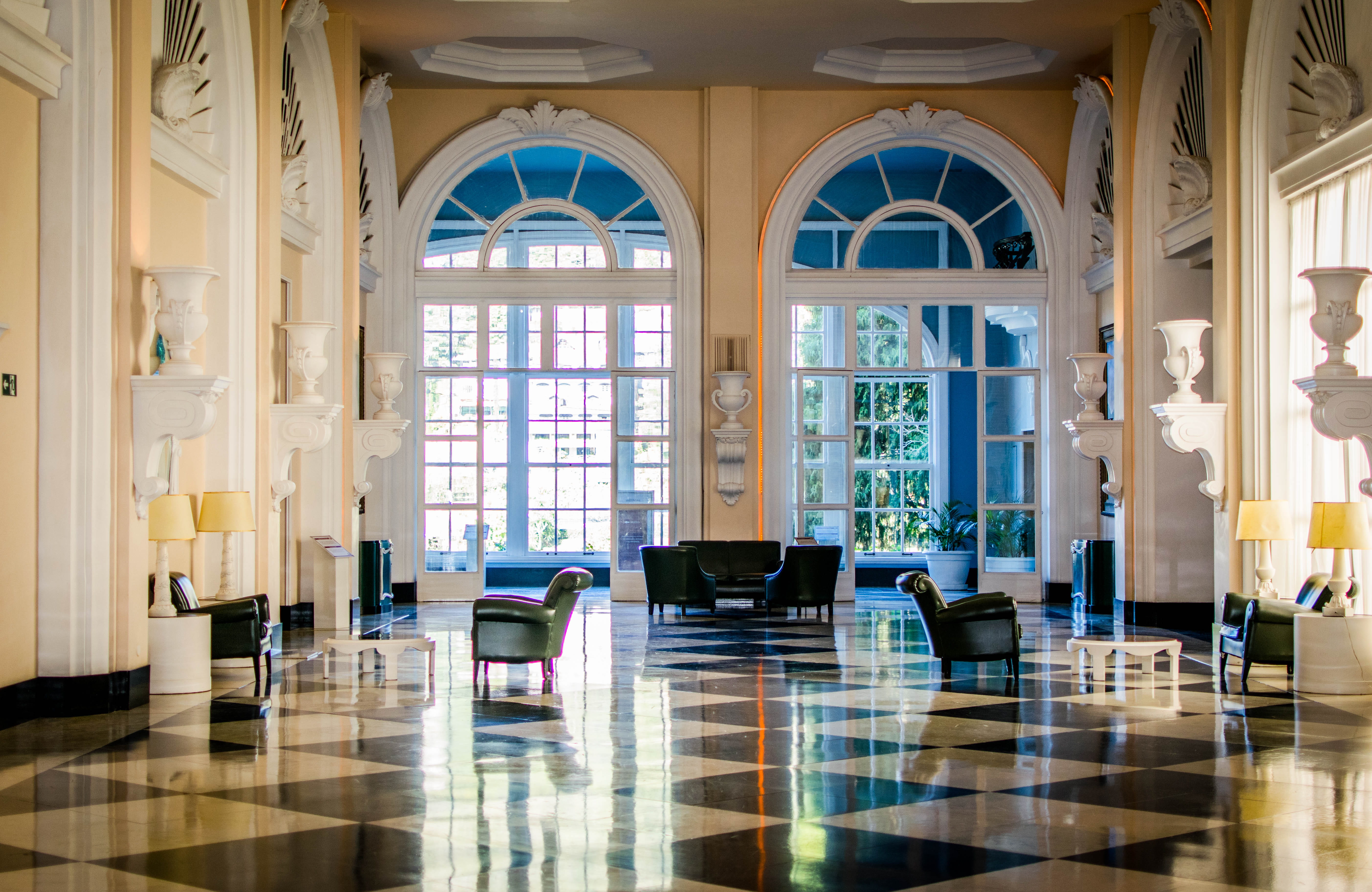 Quitandinha, black leather sofas and sofa chairs inside building