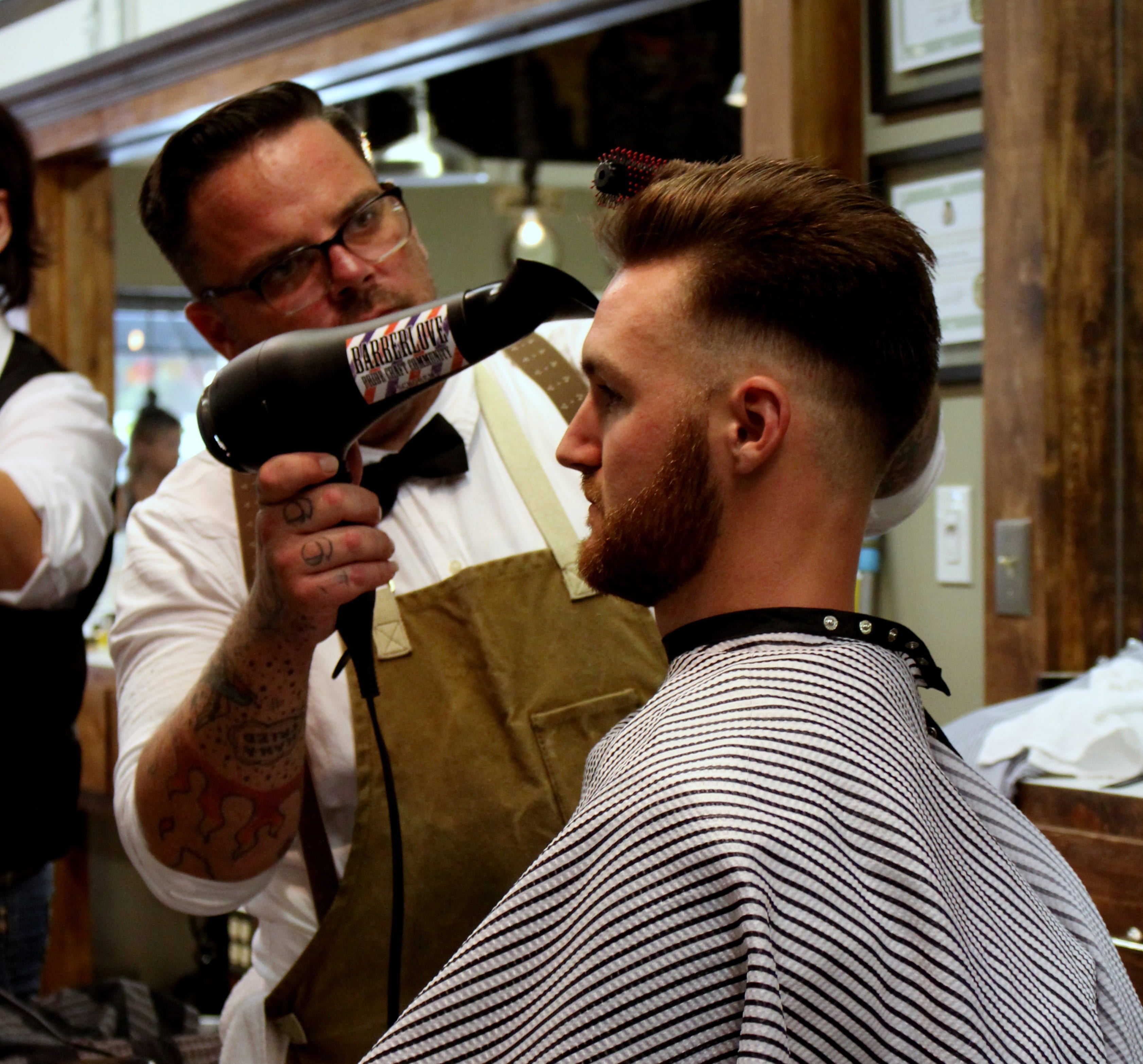 barber blow drying man's hair, hair dryer, salon, hairdresser