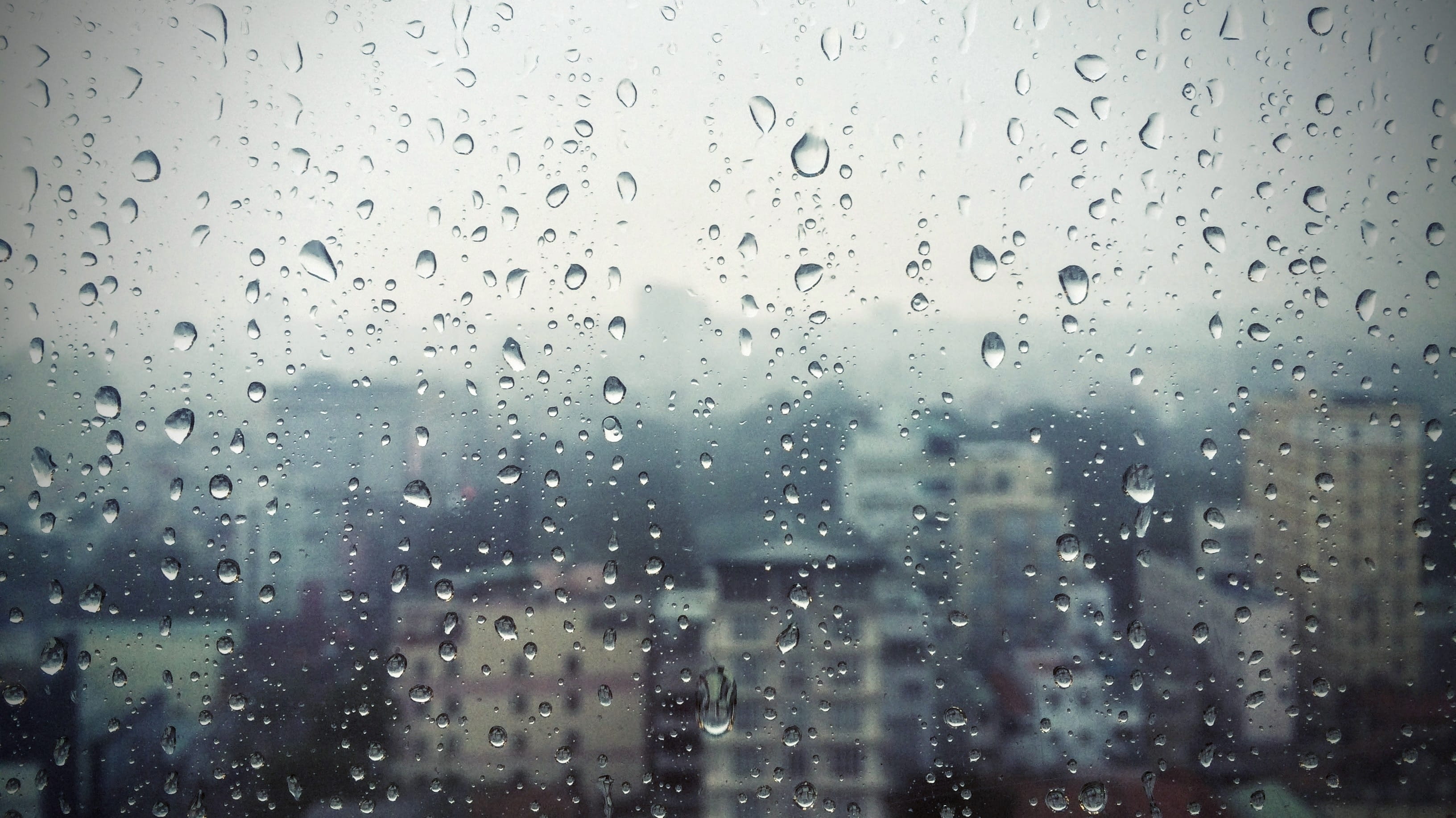 photo of water on glass, rain, raining, saigon, vietnam, window glass