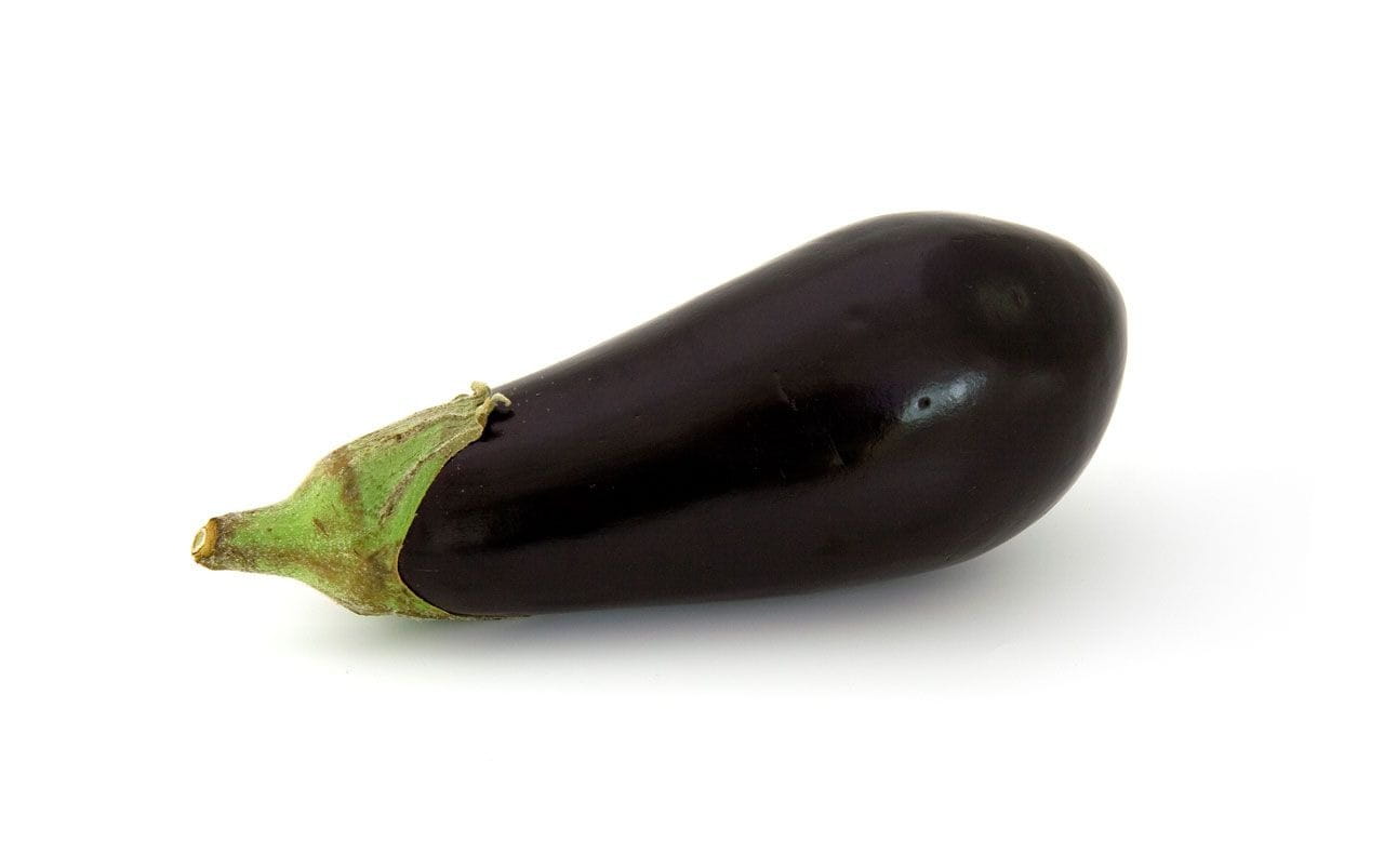 purple eggplant on white surface, aubergine, brinjal, vegetable