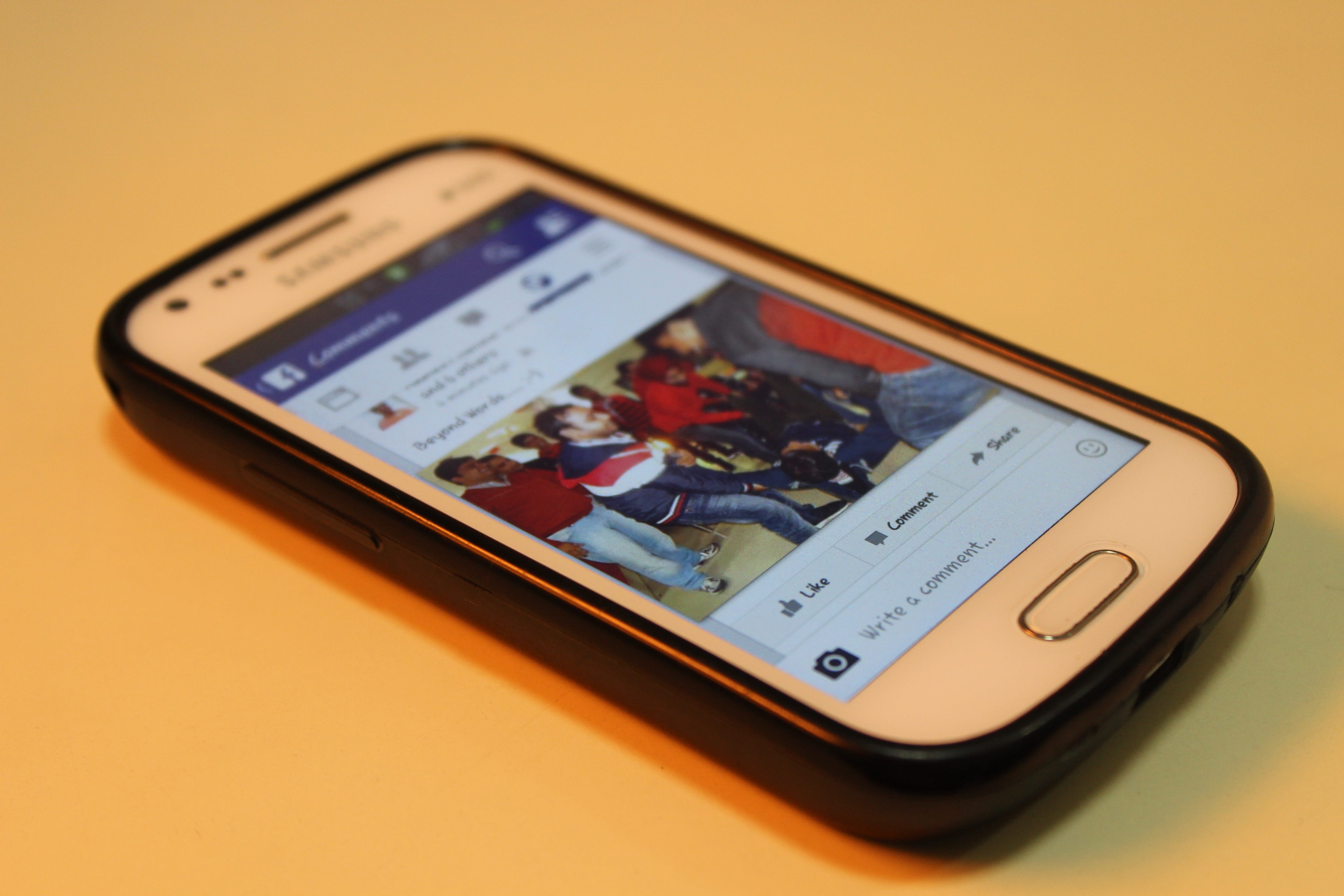 white Samsung Galaxy Android smartphone on table, Mobile, Facebook