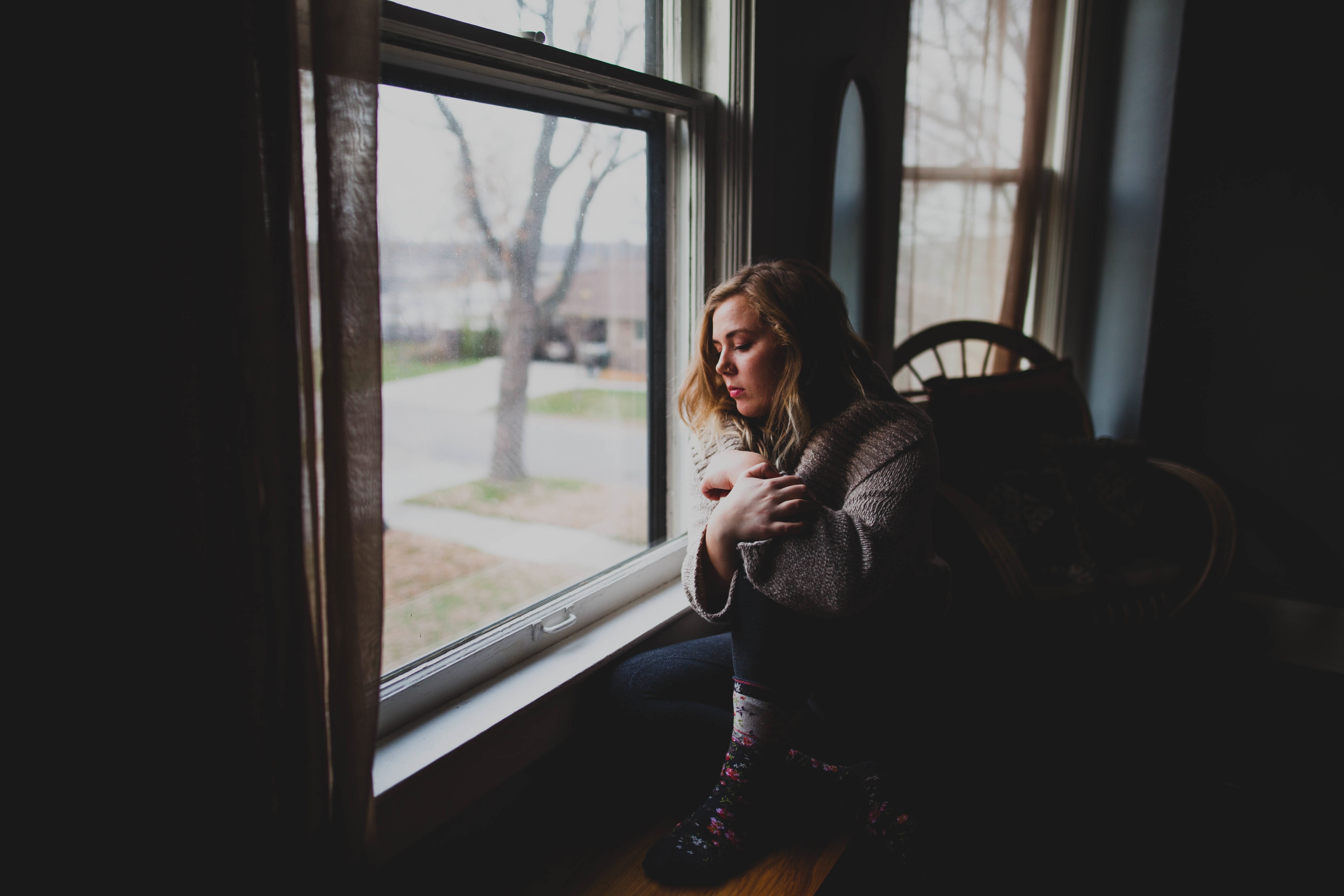 woman near window watching outside photography, gray, jacket