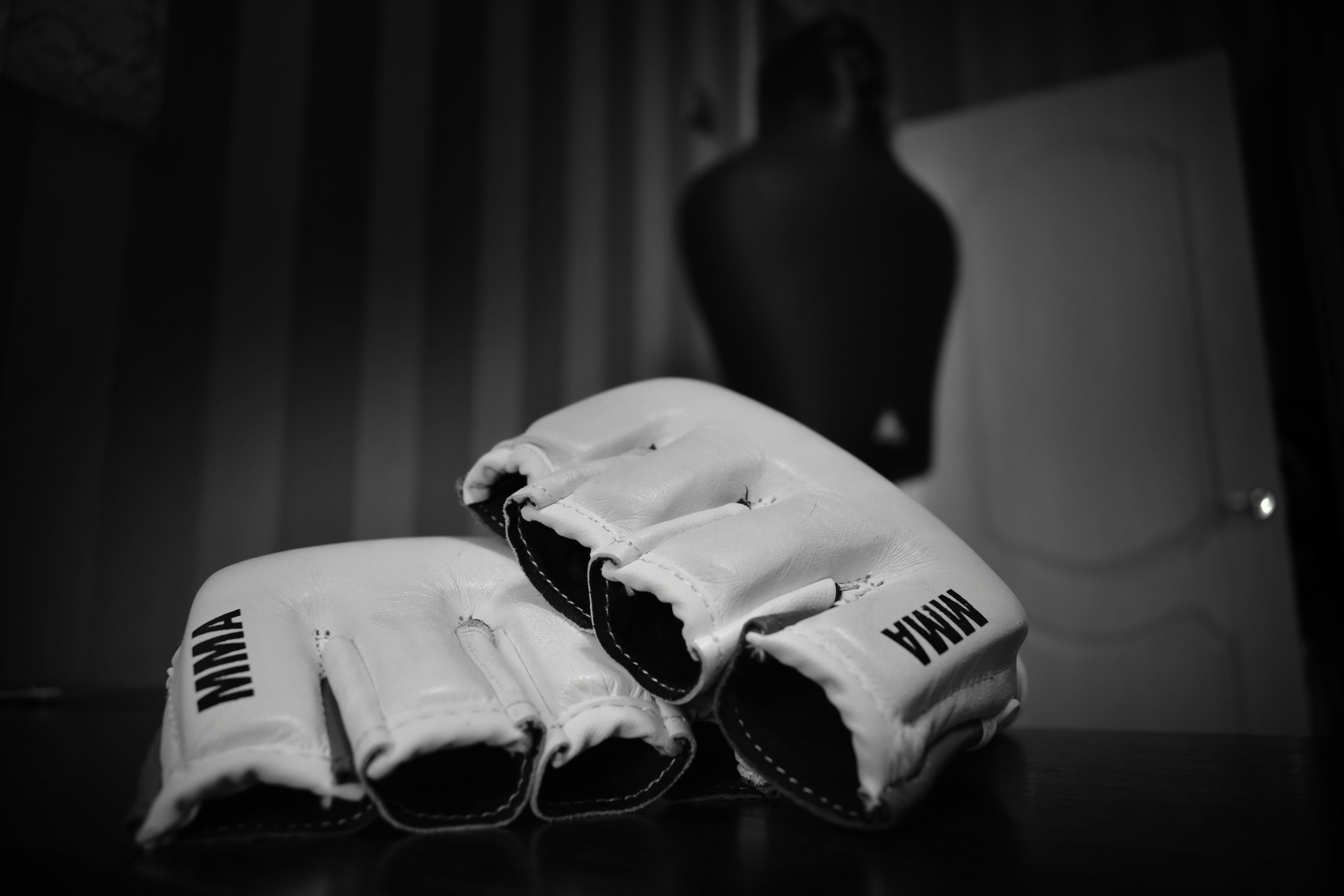 pair of white MMA gloves on table, fighter, sports, martial arts