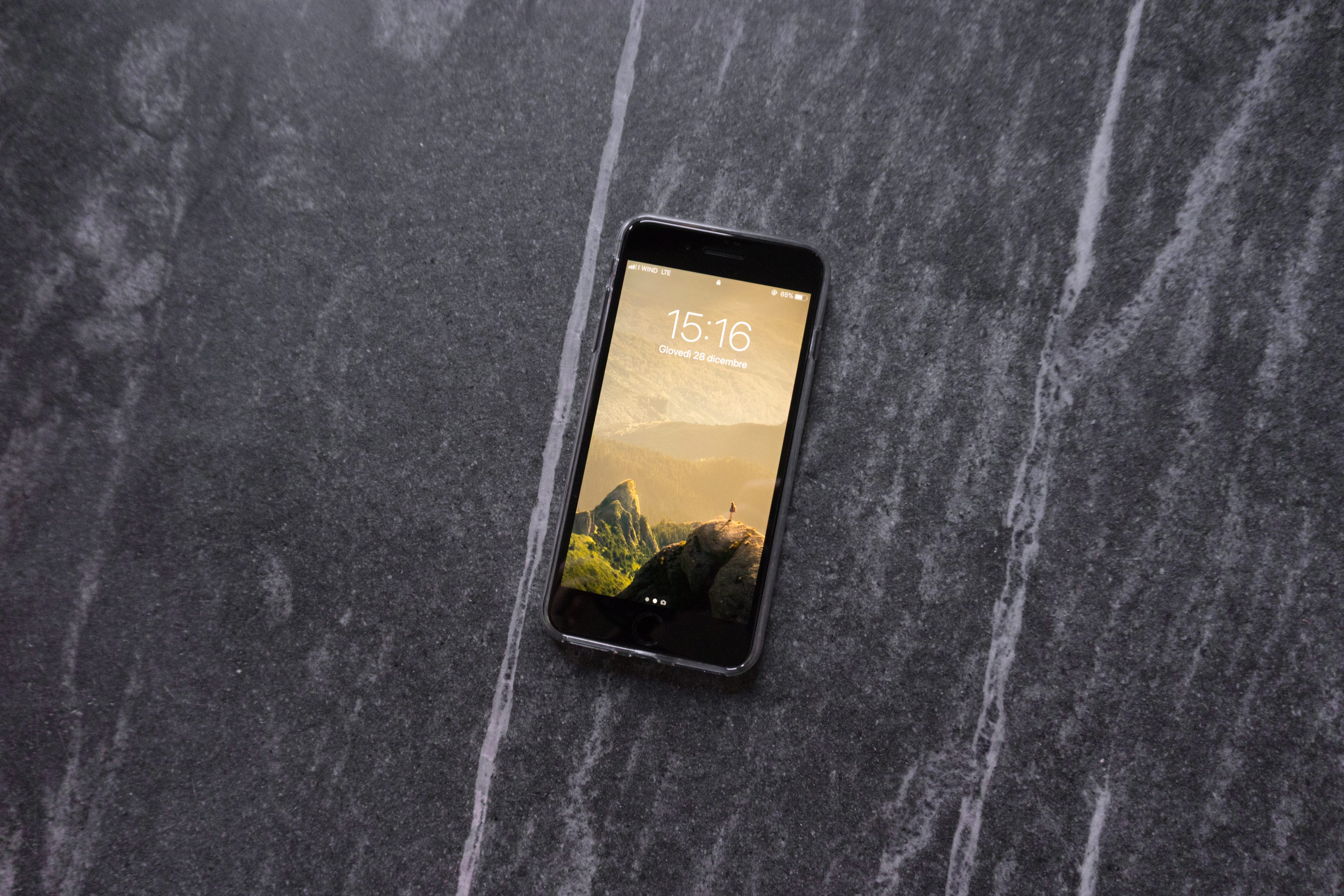 space gray iPhone 6 on tabletop, post 2017 iPhone on grey surface