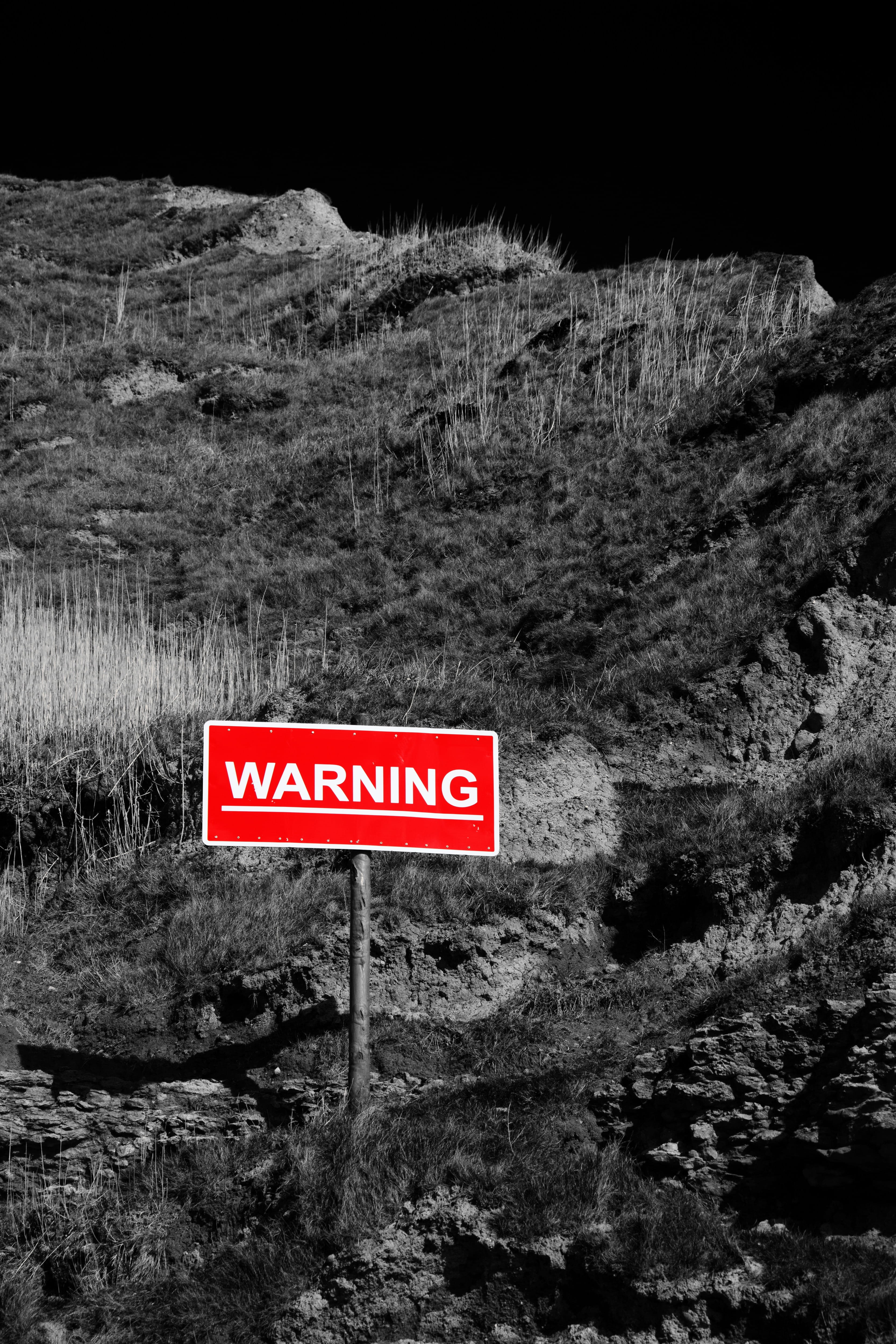 selective color of Warning signage on mountain, Area, Caution