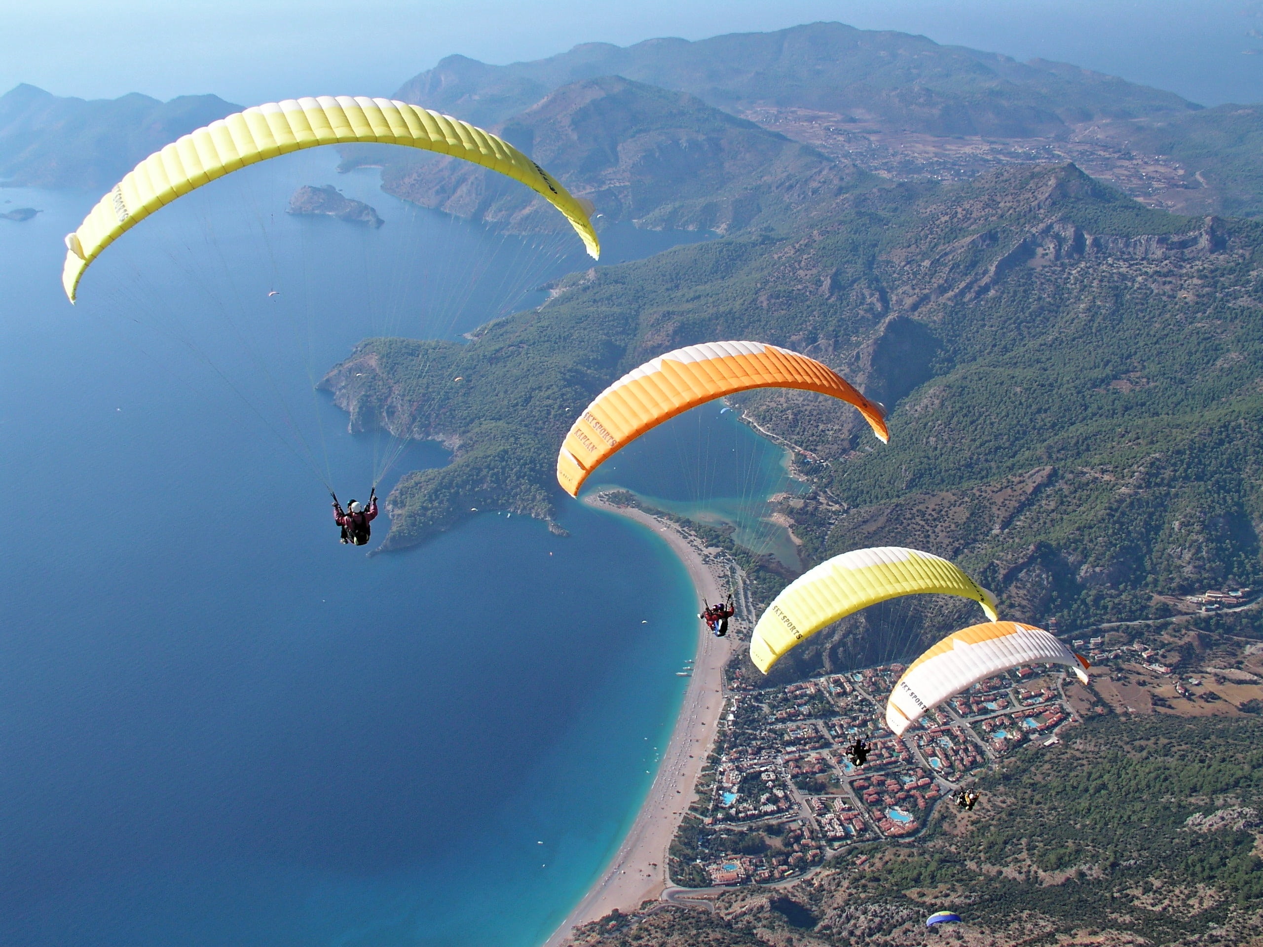 aerial photography of four gliders, paragliding, parachute, sky