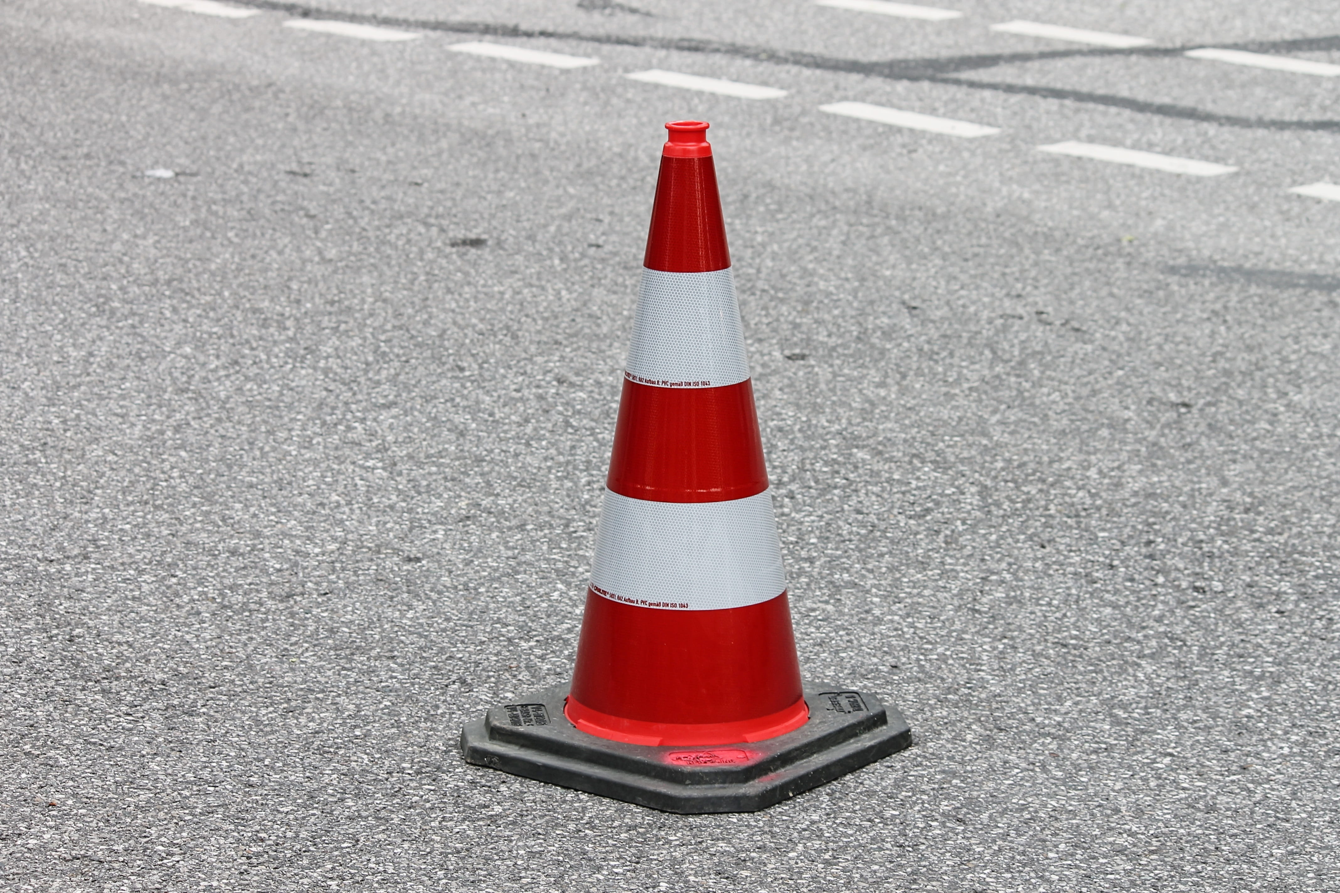 pylon, traffic cone, barrier, road sign, lock, hat, transport facility