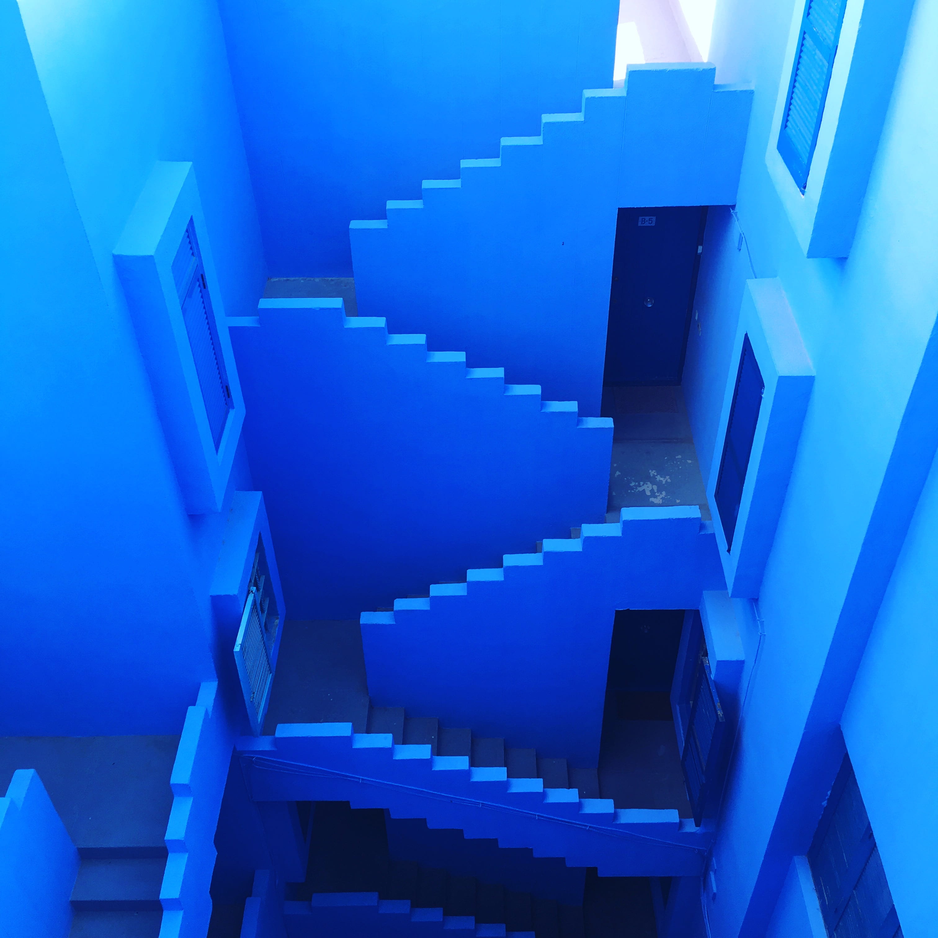 blue maze room interior, blue concrete building interior, stair