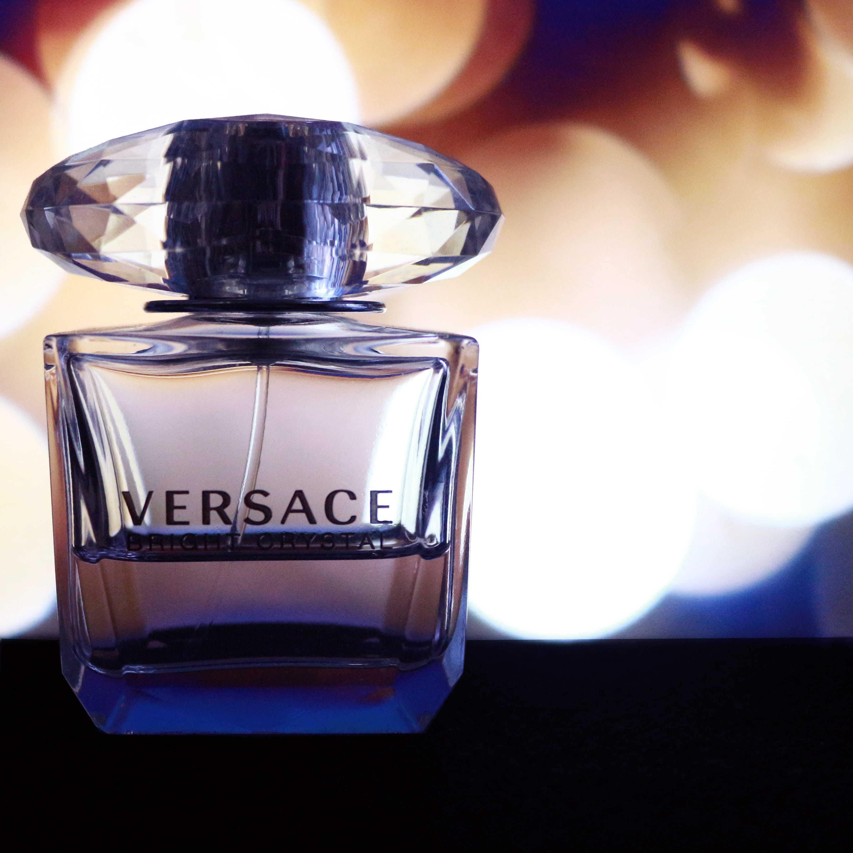 focus photography of Versace fragrance bottle, perfume, product