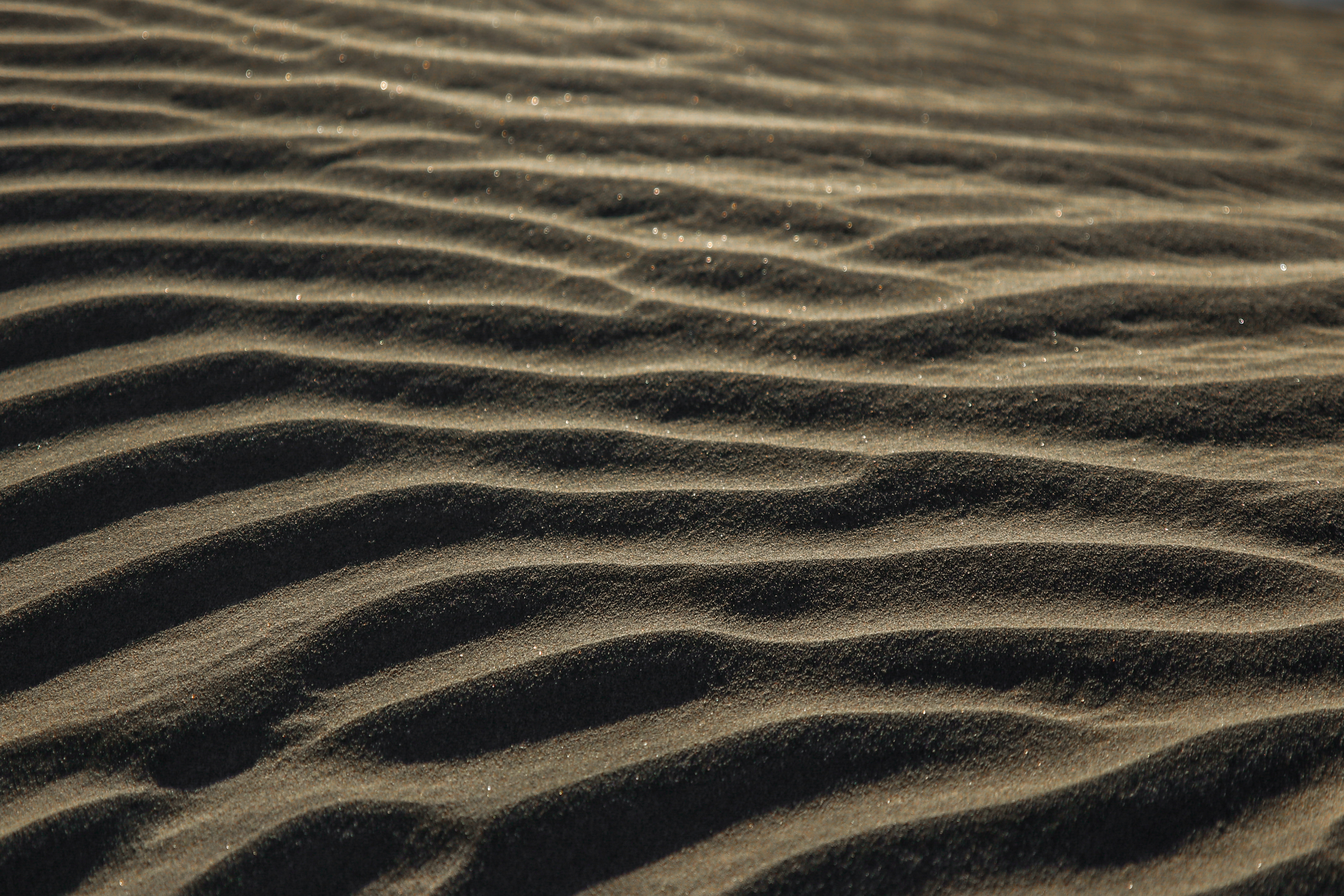 gray sand dunes, sand covered surface, ripple, desert, beach