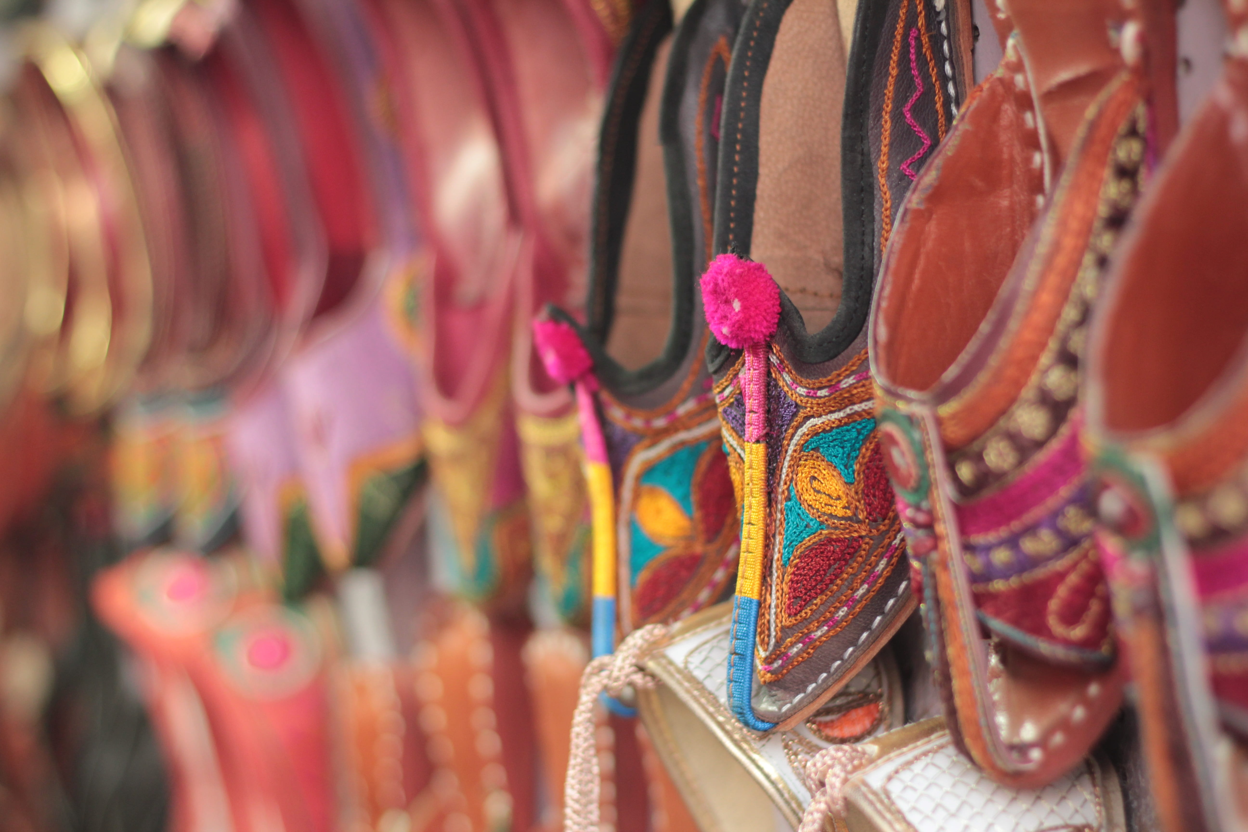 close-up photography of brown leather shoes, indian traditional