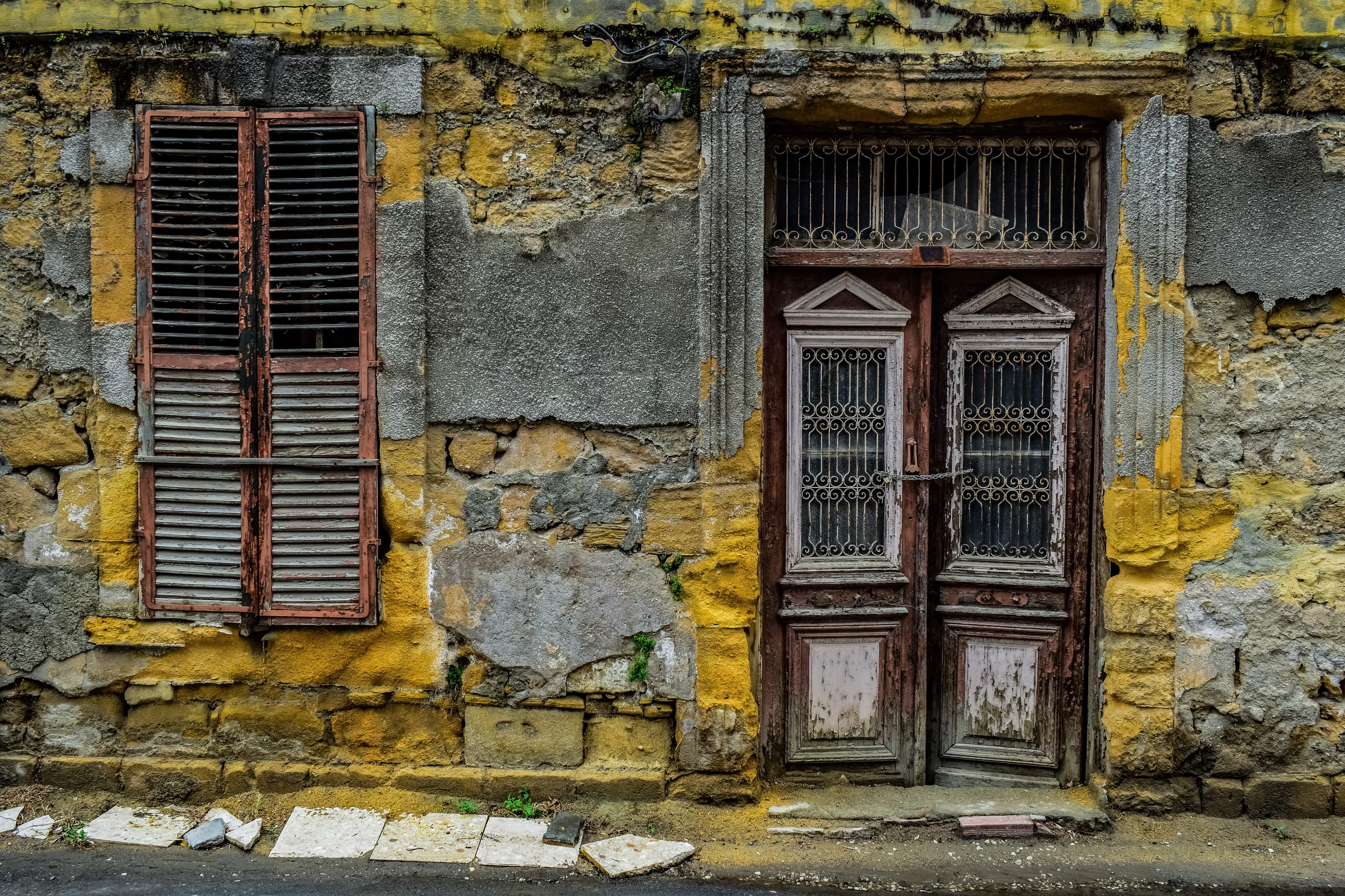 photo of yellow and brown house front, door, window, wall, architecture