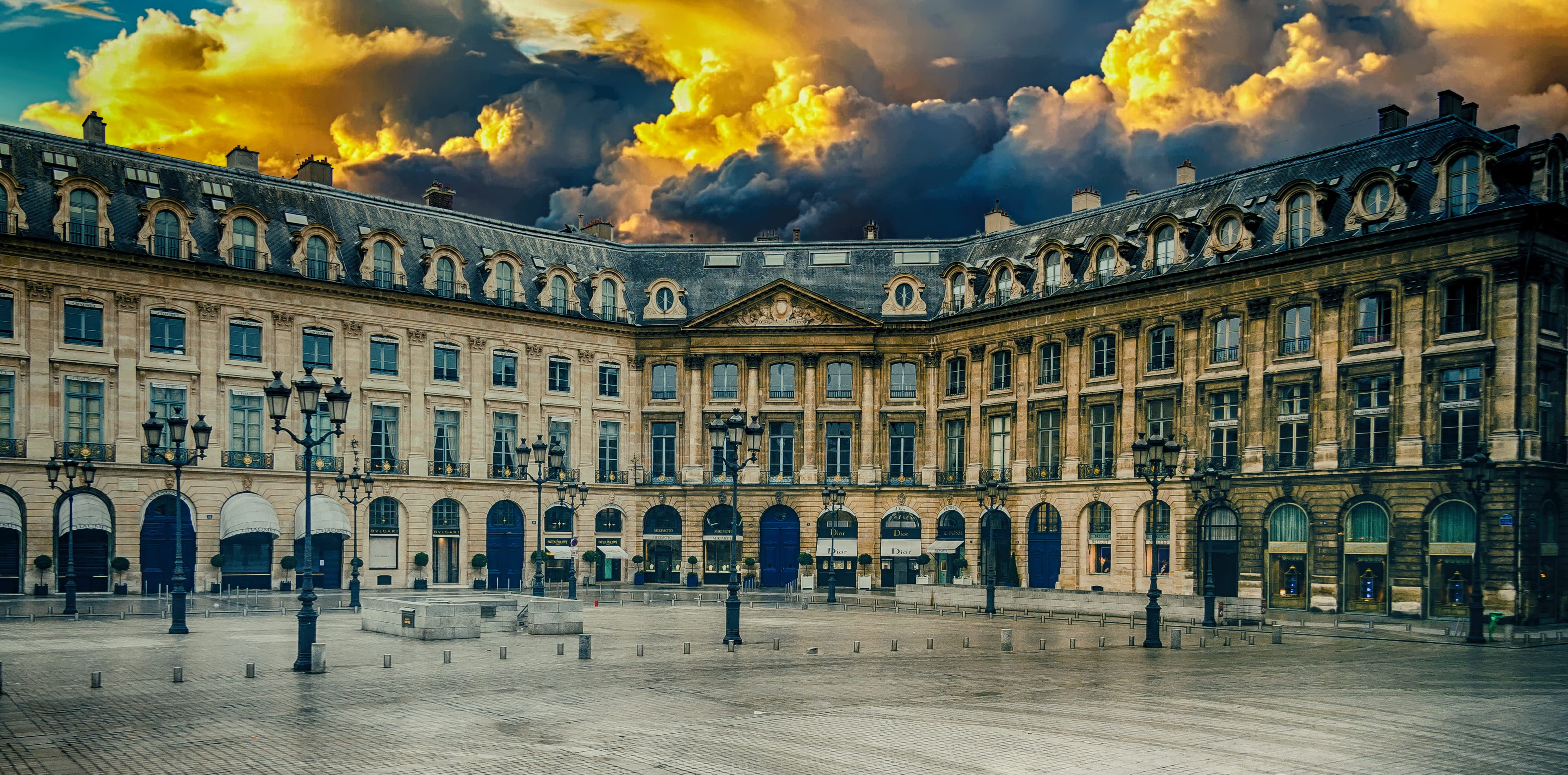 beige building under white clouds during daytime, architecture