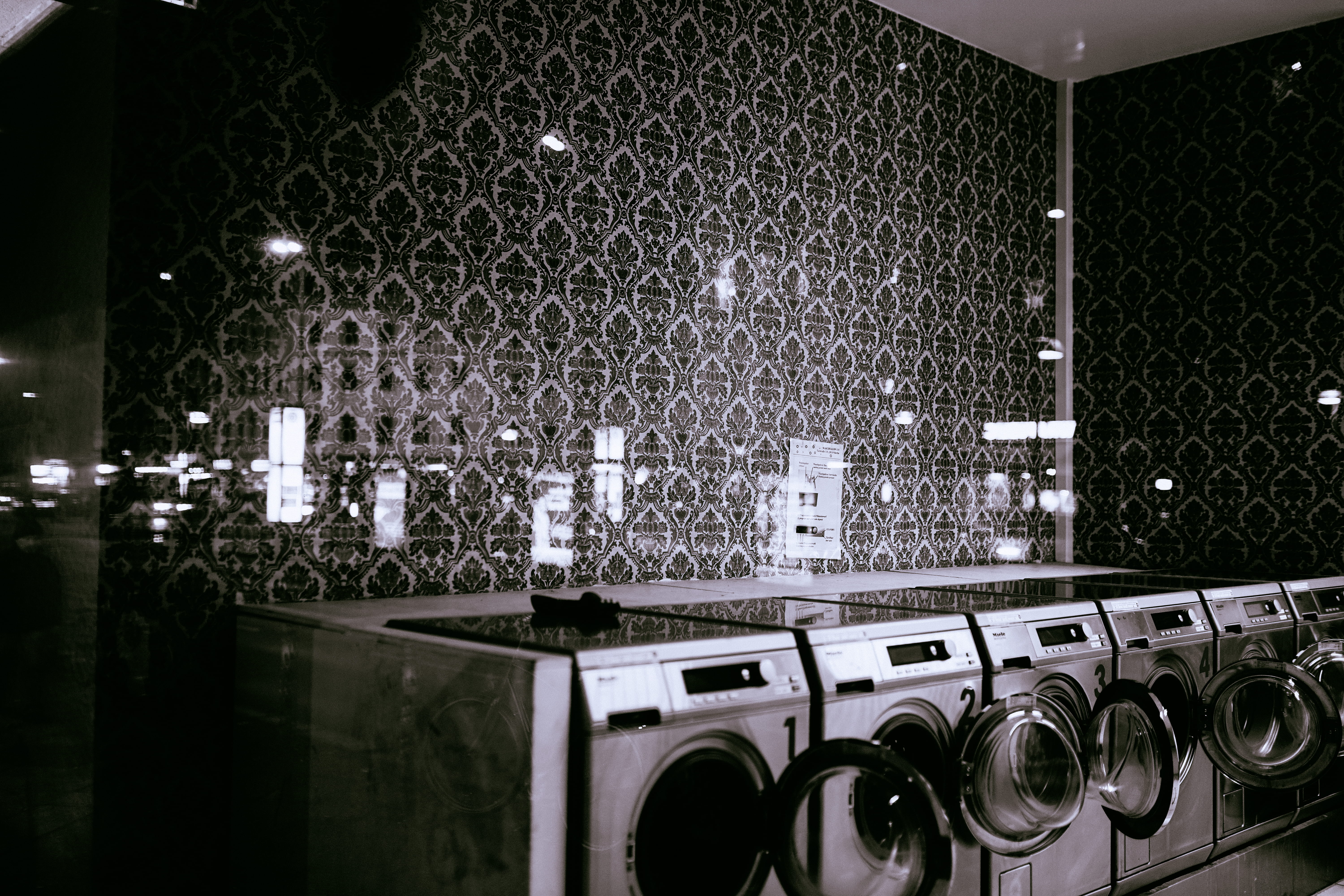 photography of gray washer and dryer during daytime, photo of front-load washer is open