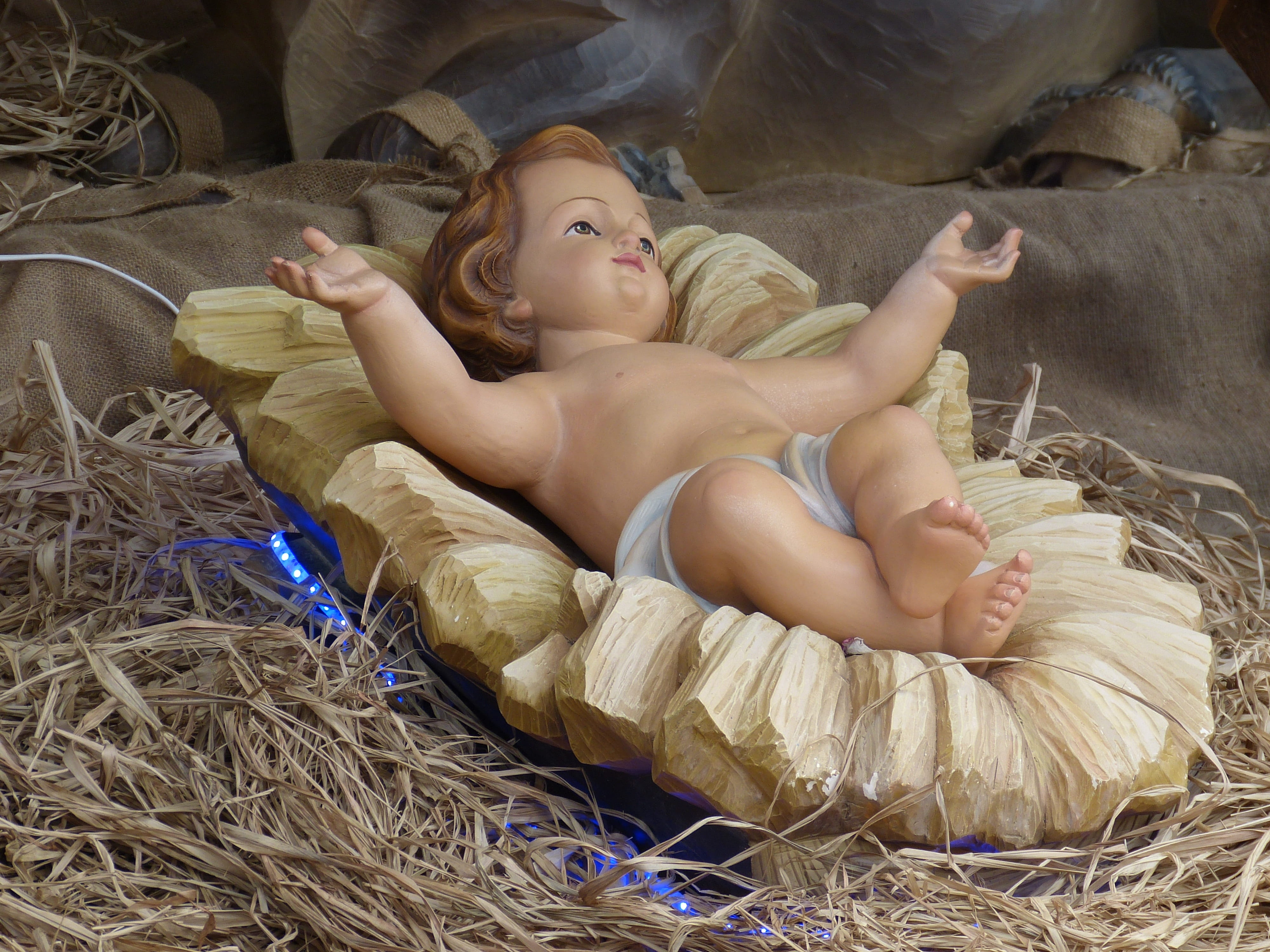 photography of baby Jesus ceramic figurine, father christmas