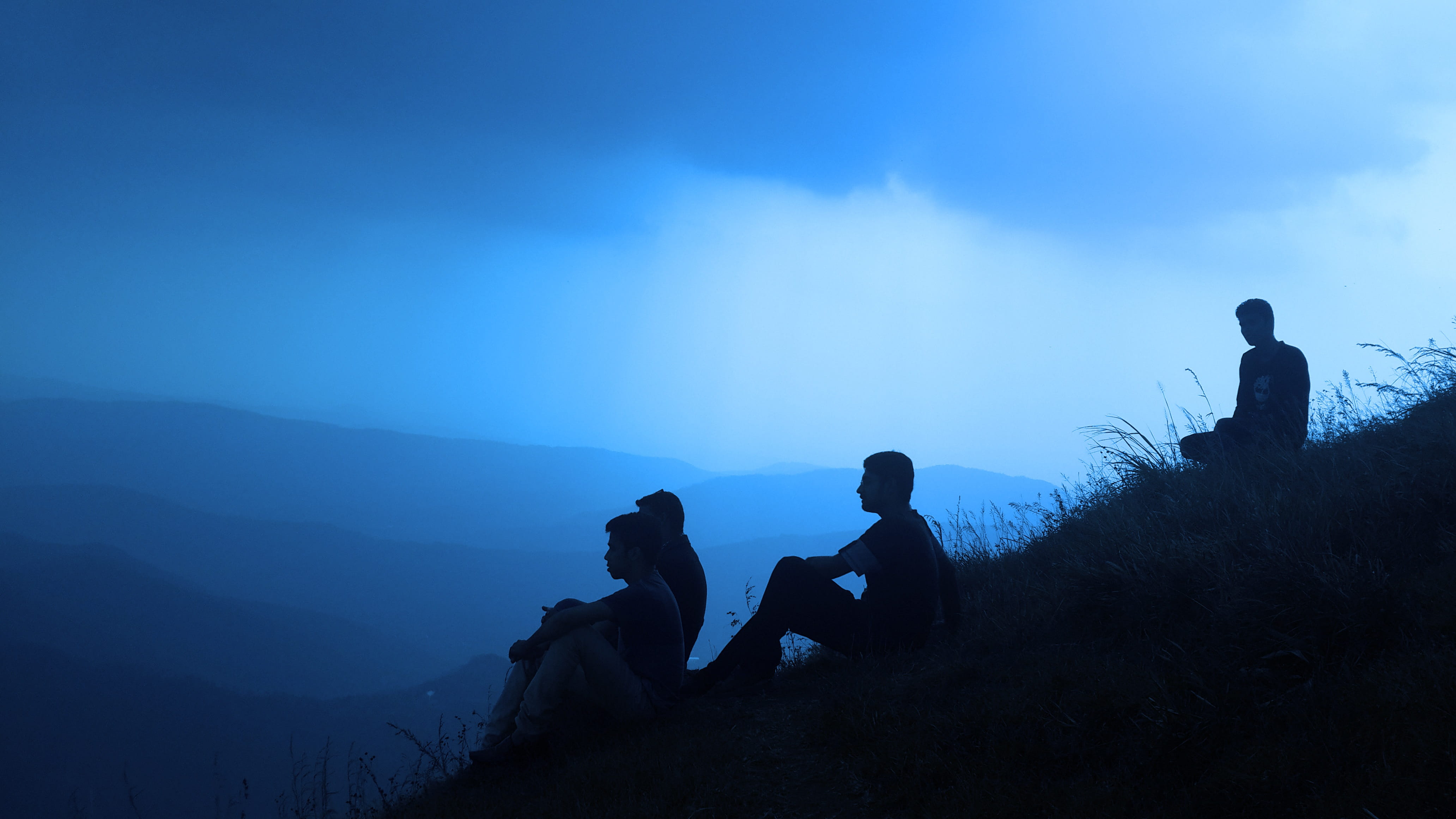 four men sitting on hill, people, hiking, outdoors, adventure