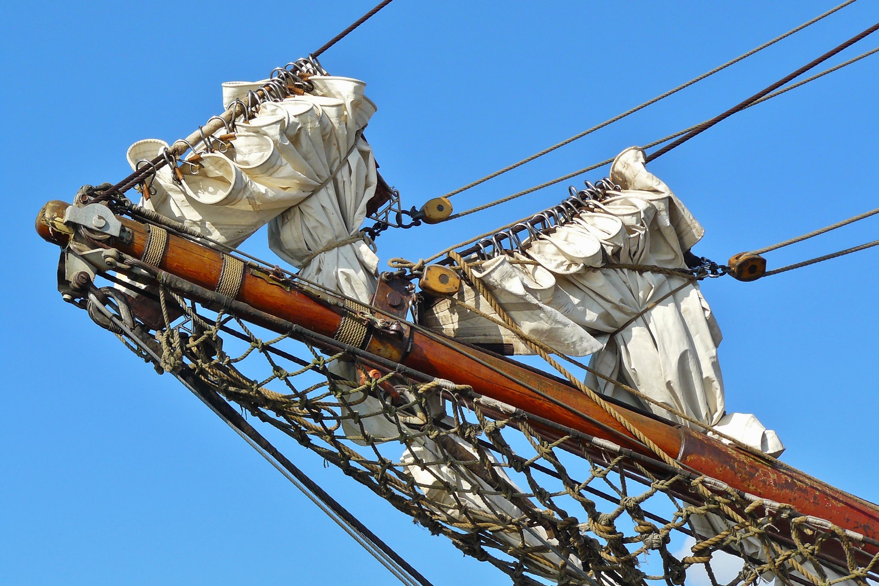 close-up photo of brown and white ship bow at day time, sailing vessel