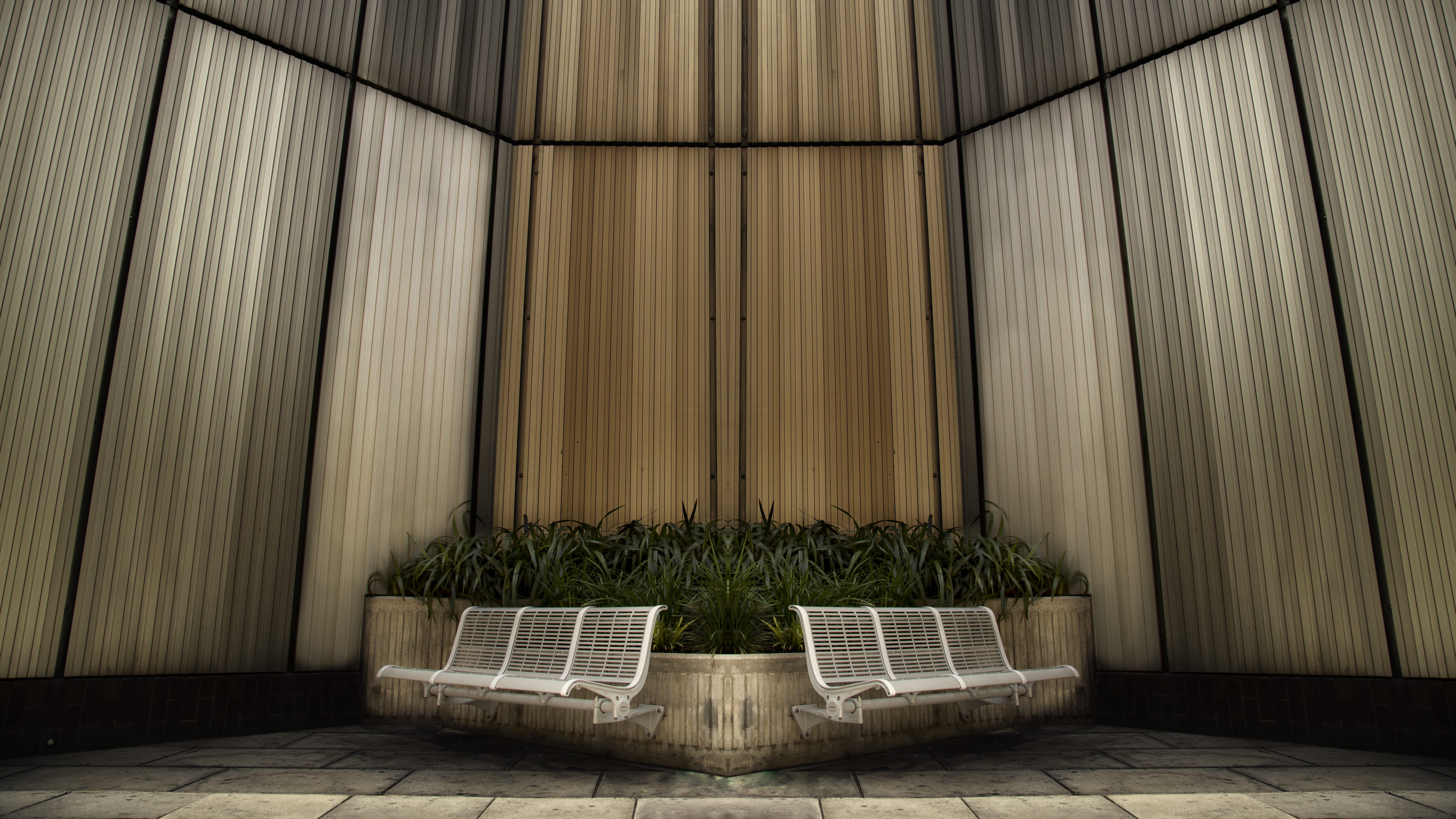 two white metal benches, architecture, wall, modern, greenery