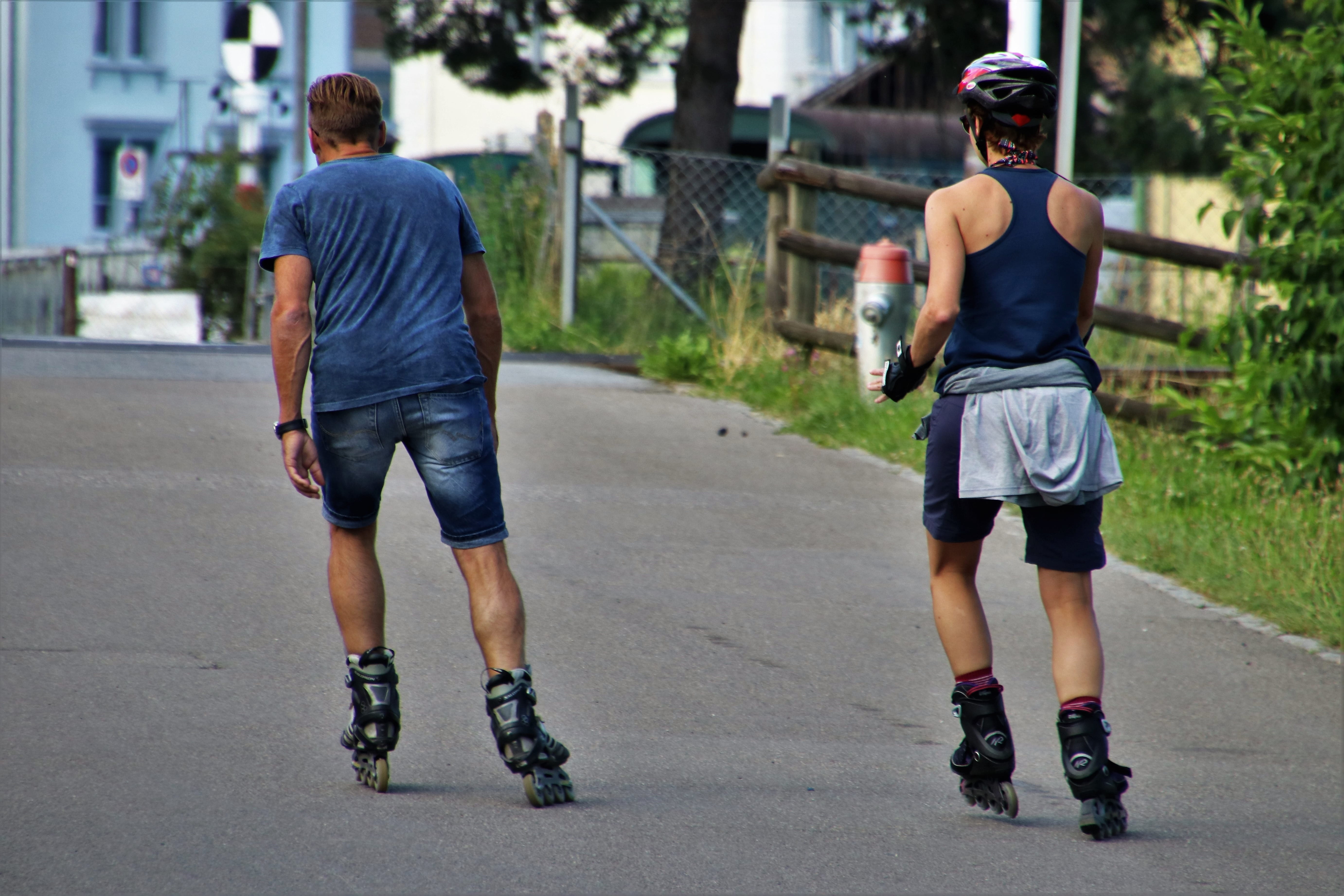 two man skating in middle of road, roller skates, para, total