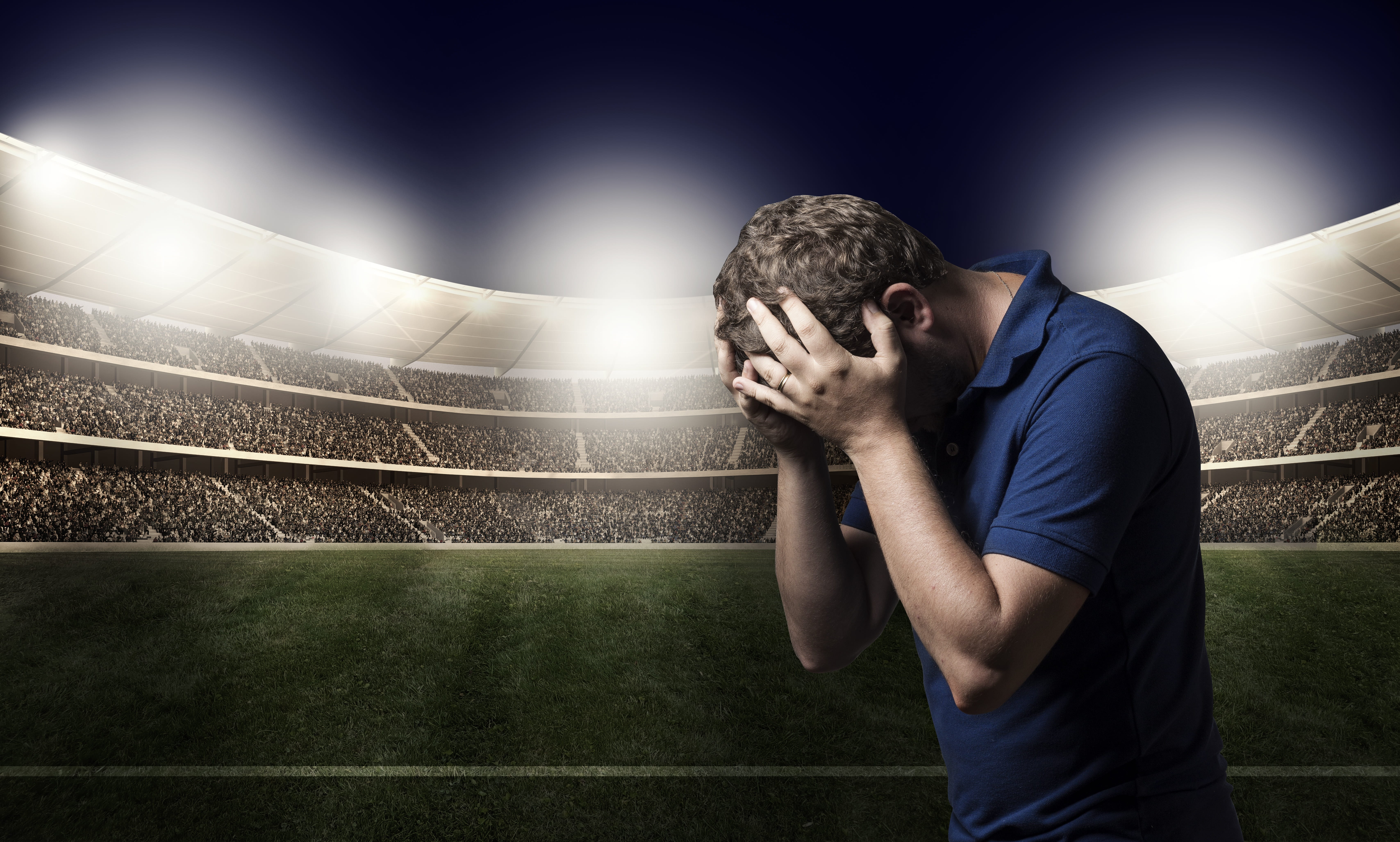 man wearing blue polo shirt, sadness, defeat, loss, football