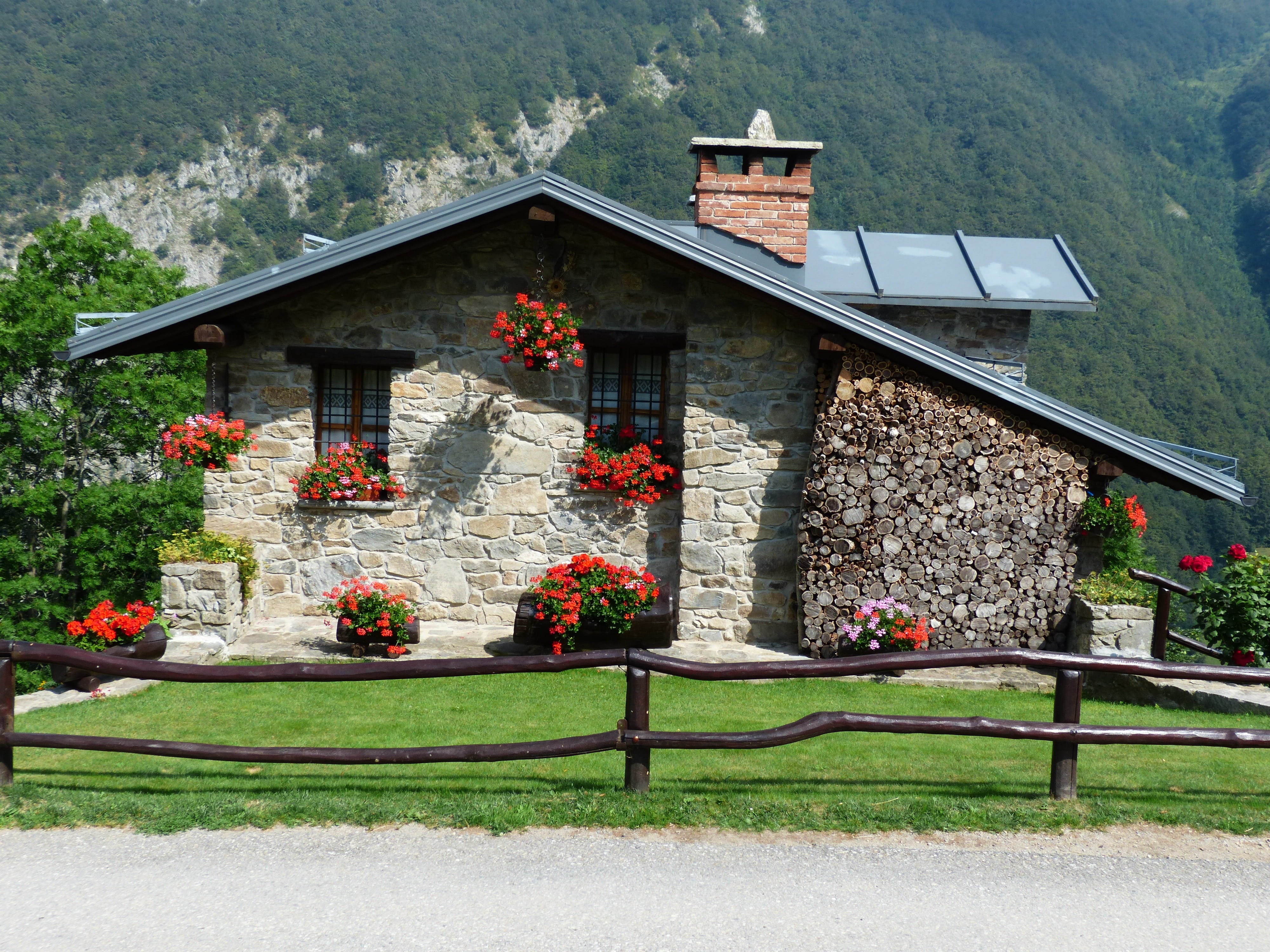 gray stone house with mountain range view, holiday house, summer house