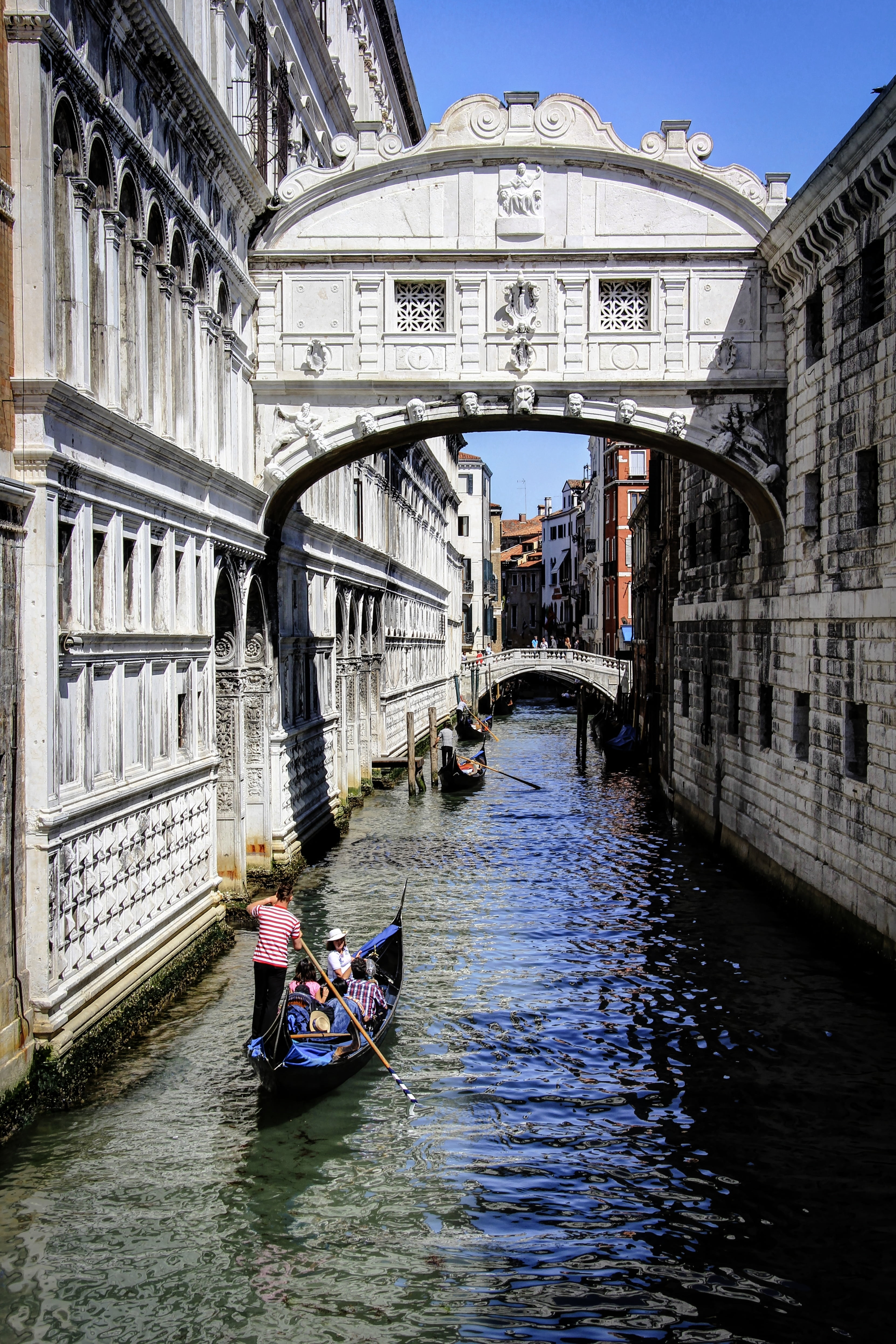 man riding boat in Bridge of Sigh, Venice at daytime, italy, vacation